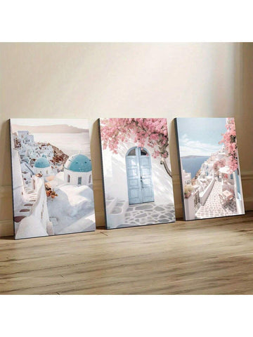 Bring a splash of the Greek Isles into your space with this playful 3-piece Santorini canvas set. Featuring iconic white architecture, bright blue rooftops, and delightful pink flowers, it captures the charm of coastal Greece perfectly. These vibrant panels add a joyful, sun-soaked vibe to any room, inviting you to dream of seaside adventures every day.