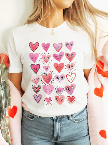 Add a touch of whimsy to your wardrobe with our Charming Cartoon Heart Print Round Neck Tee for Women! Made from soft and comfortable fabric, this tee features a playful cartoon heart print design that will make you stand out. Perfect for adding a fun and quirky element to any outfit!