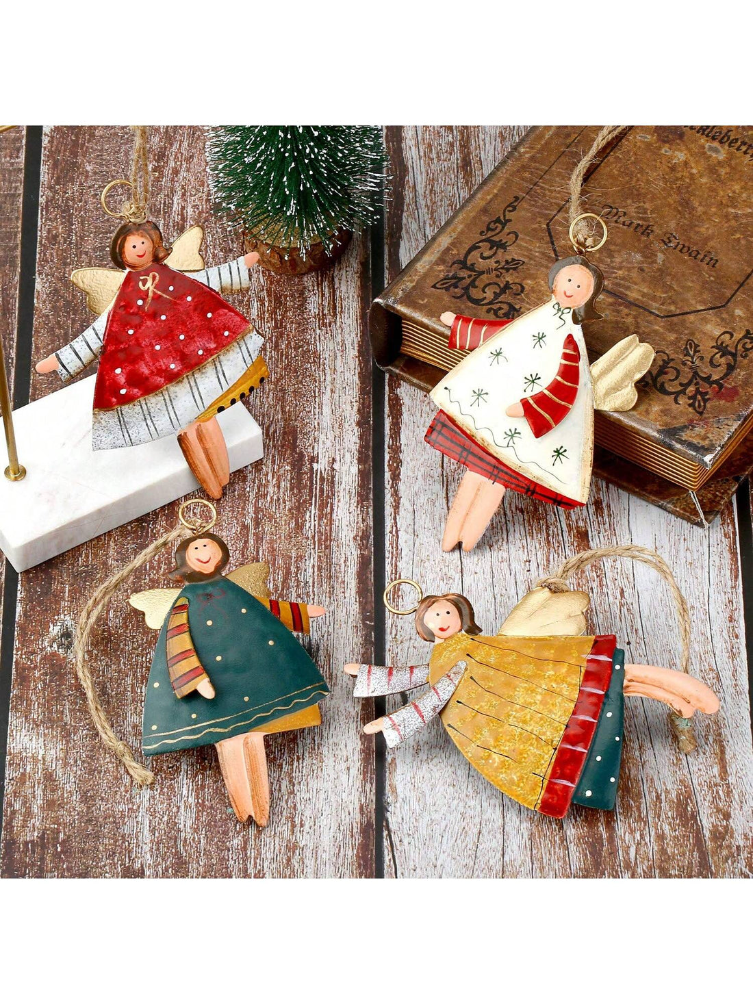 Add a touch of rustic charm to your holiday decor with these Charming Countryside Double-Sided Metal Christmas Tree Ornaments. This set of four Santa Claus pendants are handcrafted from durable metal and feature intricate detailing on both sides. Perfect for adding a festive touch to your tree or holiday displays.