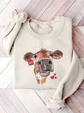 Add some charm to your wardrobe with this Charming Cow Heart Print Sweatshirt. The loose fit is perfect for a casual look, and the crew neck makes it ideal for spring and autumn. Made with a quirky cow heart print, this sweatshirt is sure to make you stand out from the herd.