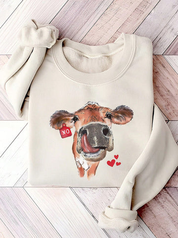 Add some charm to your wardrobe with this Charming Cow Heart Print Sweatshirt. The loose fit is perfect for a casual look, and the crew neck makes it ideal for spring and autumn. Made with a quirky cow heart print, this sweatshirt is sure to make you stand out from the herd.
