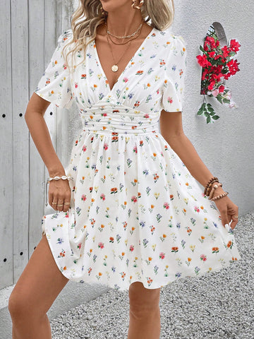 Effortlessly achieve a charming summer look with our Ditsy Floral Cinching Waist Dress. The elegant floral print and cinched waist create a flattering silhouette, perfect for any occasion. Stay stylish and comfortable with this must-have dress.