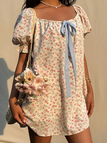 Step into sunshine with this Charming Ditsy Floral Mini Dress! Featuring a flirty square neckline and playful puff sleeves, it’s the perfect pick for breezy summer days. The delicate floral print adds a touch of whimsy, while the mini length keeps your look fresh and fun. Effortless style has never been so charming!