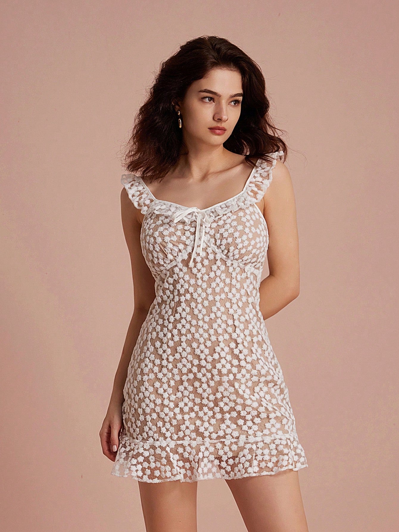 Step into sunshine with this Charming Floral Embroidery Tie Front Cami Dress! Delicate floral embroidery and a playful tie front add a flirty touch, while the ruffle hem dances with every step. Perfect for effortless elegance on warm days, this dress brings a breezy, fun vibe to your wardrobe.