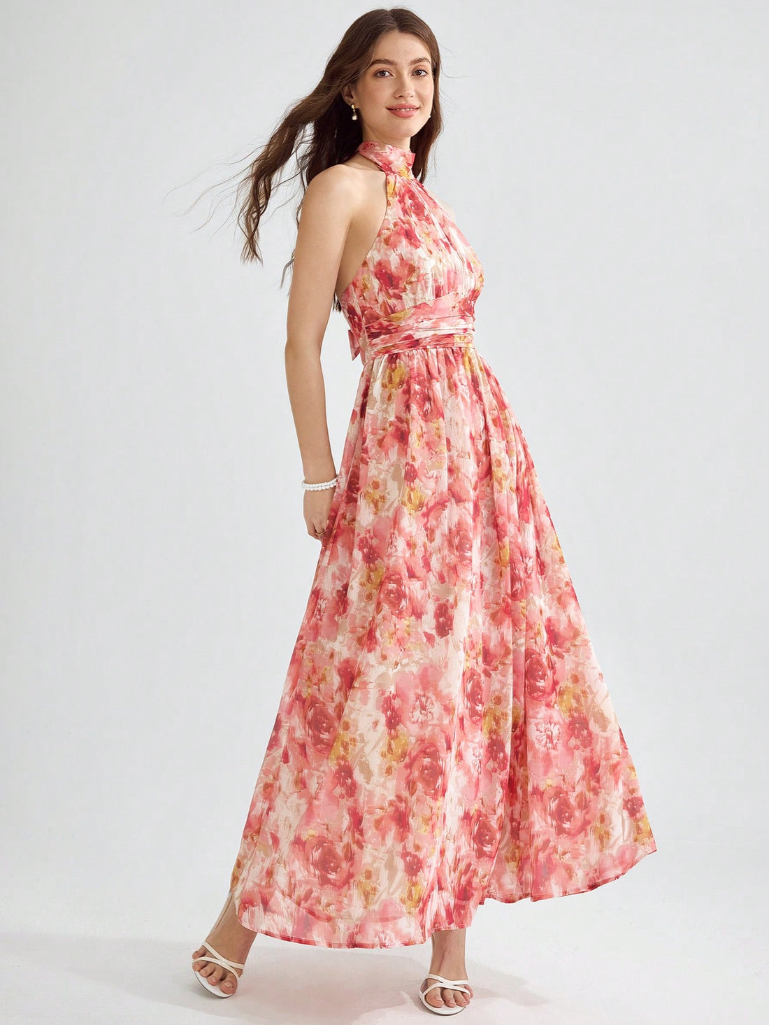 This floral sundress is perfect for any occasion! With its backless design, halter neckline, and charming print, you'll turn heads wherever you go. From weddings to parties to summer vacations, this dress has got you covered. Look beautiful and feel confident in this must-have piece!