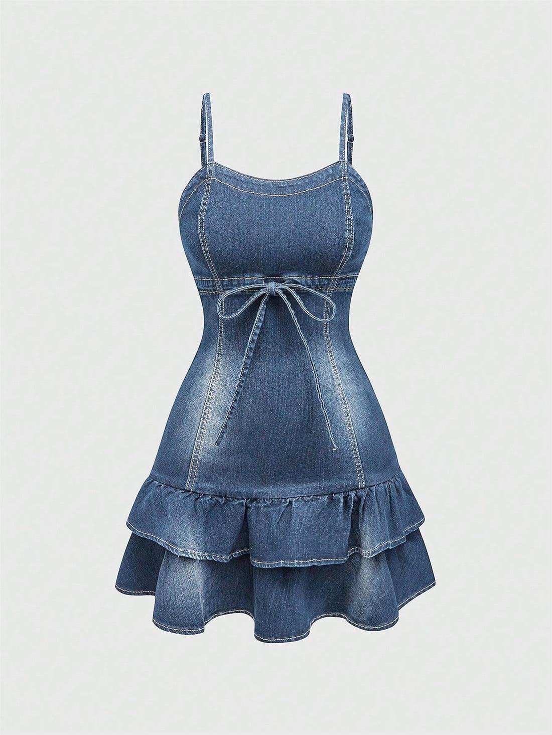 Expertly crafted and charming, this Kawaii Denim Dress features delicate spaghetti straps and a playful ruffle hem. Made from high-quality denim, it's perfect for any occasion and exudes a youthful and modern style. Elevate your wardrobe with this must-have piece and stand out with its unique and stylish design.