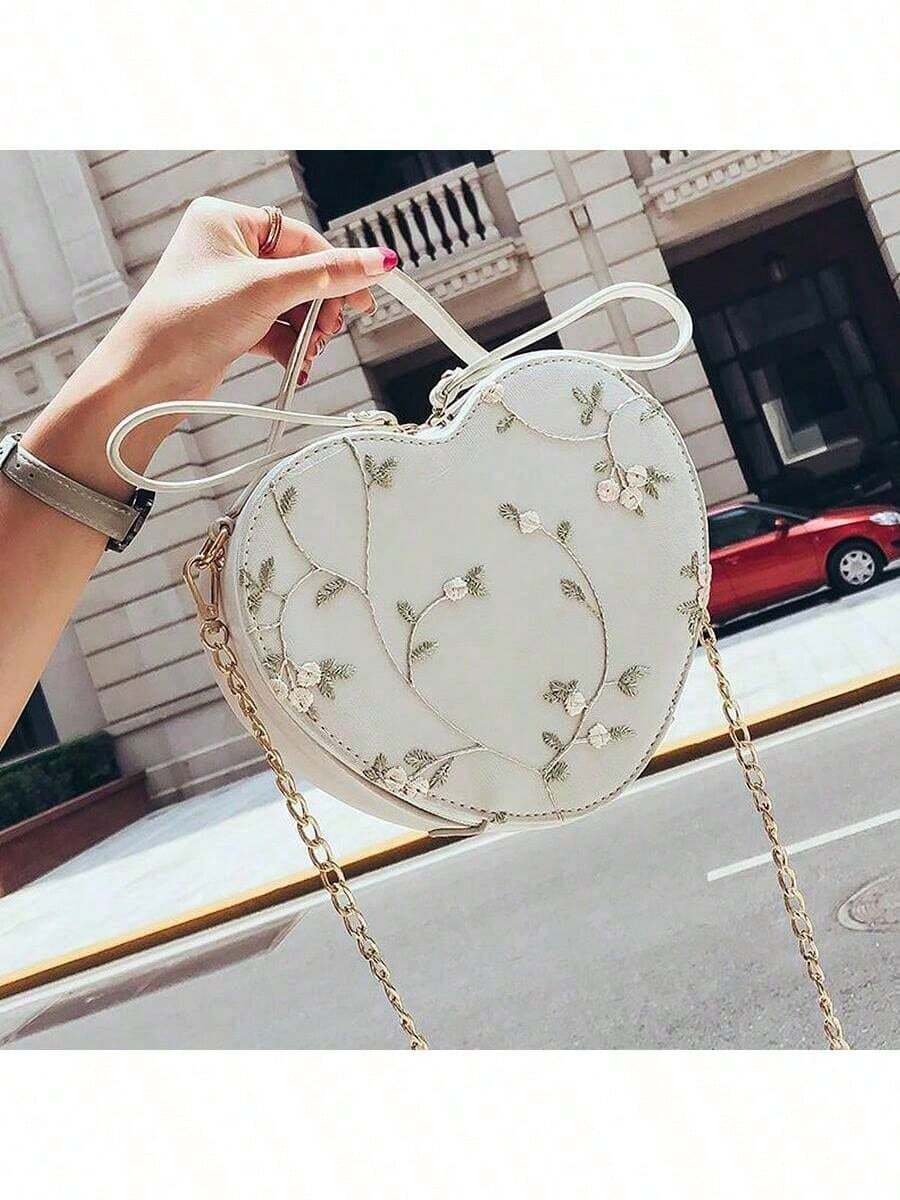 Add a touch of romance to your look with this Charming Lace Heart-Shaped Crossbody Bag. Delicately embroidered and perfectly heart-shaped, it’s the ideal playful accessory for stylish ladies who want to stand out. Lightweight and easy to carry, it keeps your essentials close while adding a sweet, feminine flair to any outfit.