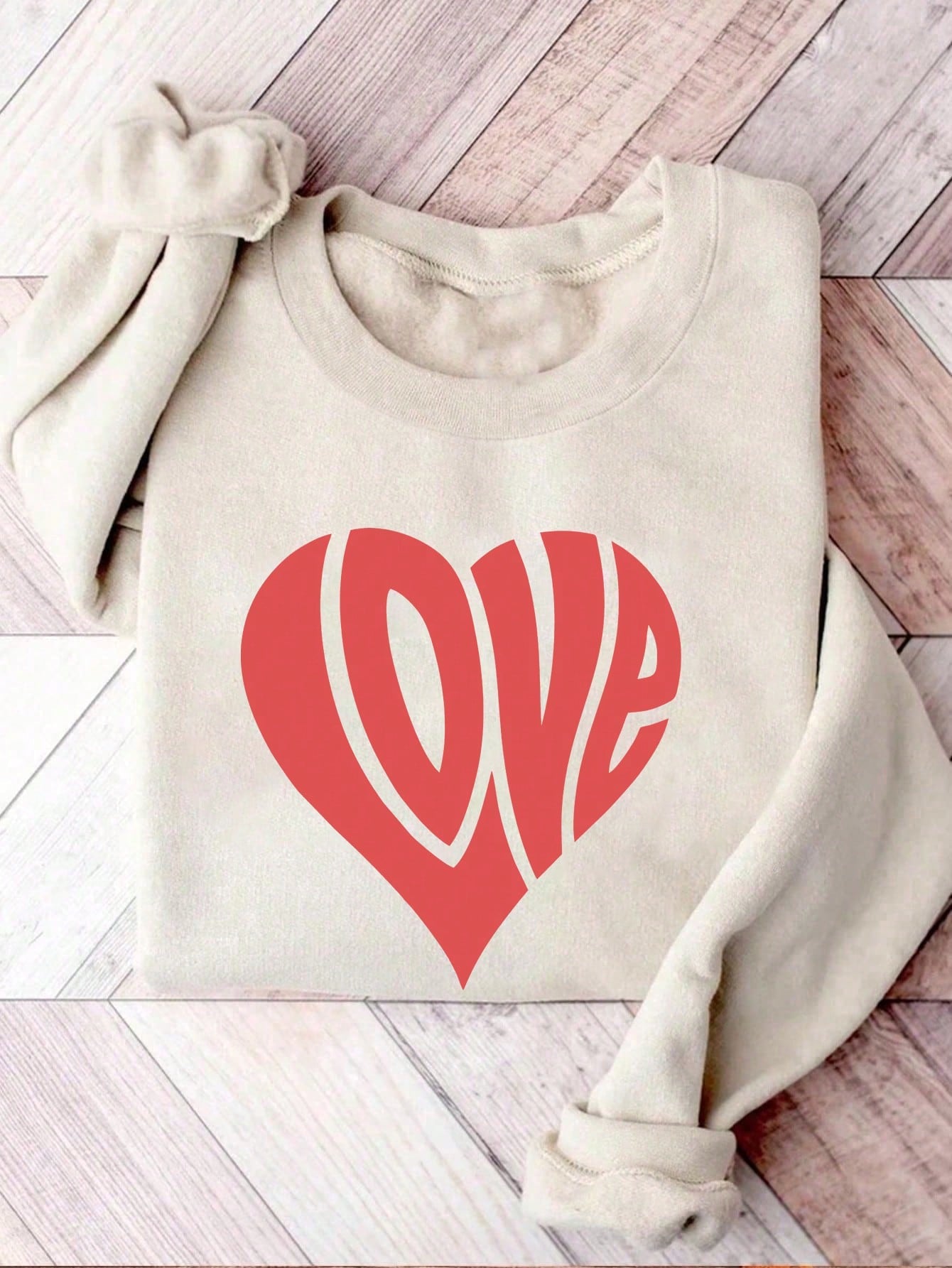 Get cozy and charming in our Valentine's Day sweatshirt. Perfect for snuggling with your sweetheart (or your pet) on a romantic evening. Declare your love in style with our playful love themed graphic. Limited edition, so grab yours now!