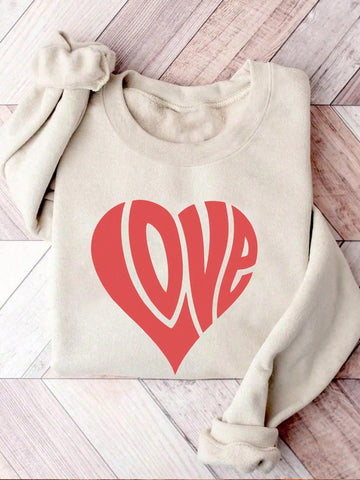 Get cozy and charming in our Valentine's Day sweatshirt. Perfect for snuggling with your sweetheart (or your pet) on a romantic evening. Declare your love in style with our playful love themed graphic. Limited edition, so grab yours now!