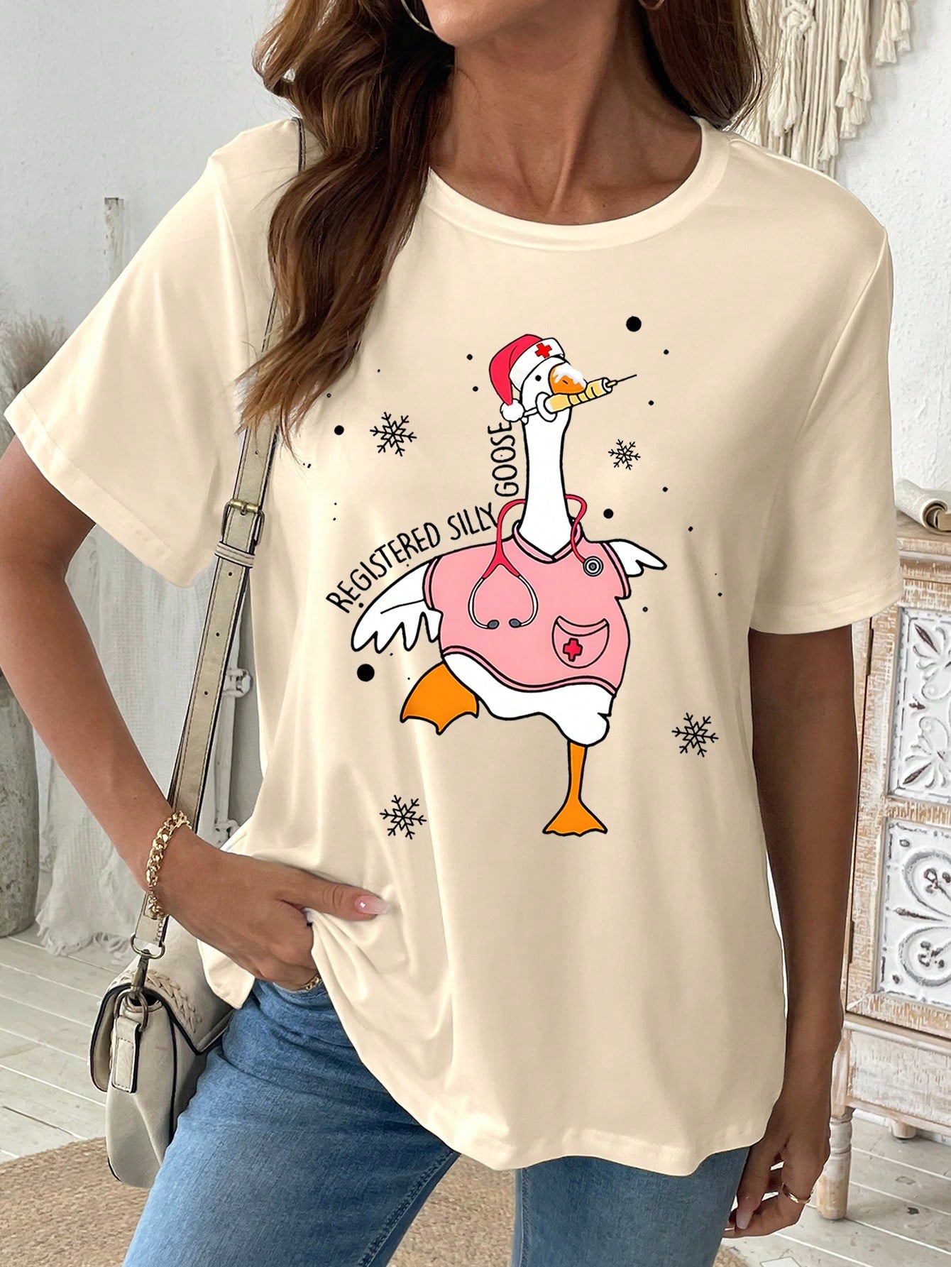 Stay comfortable and stylish this spring and summer with our Charming Nurse-Approved Duck & Snowflake Print Tee. Expert-approved for nurses, this tee features a charming print that will add a touch of whimsy to any outfit. Made with lightweight materials for maximum comfort, it's perfect for any season.