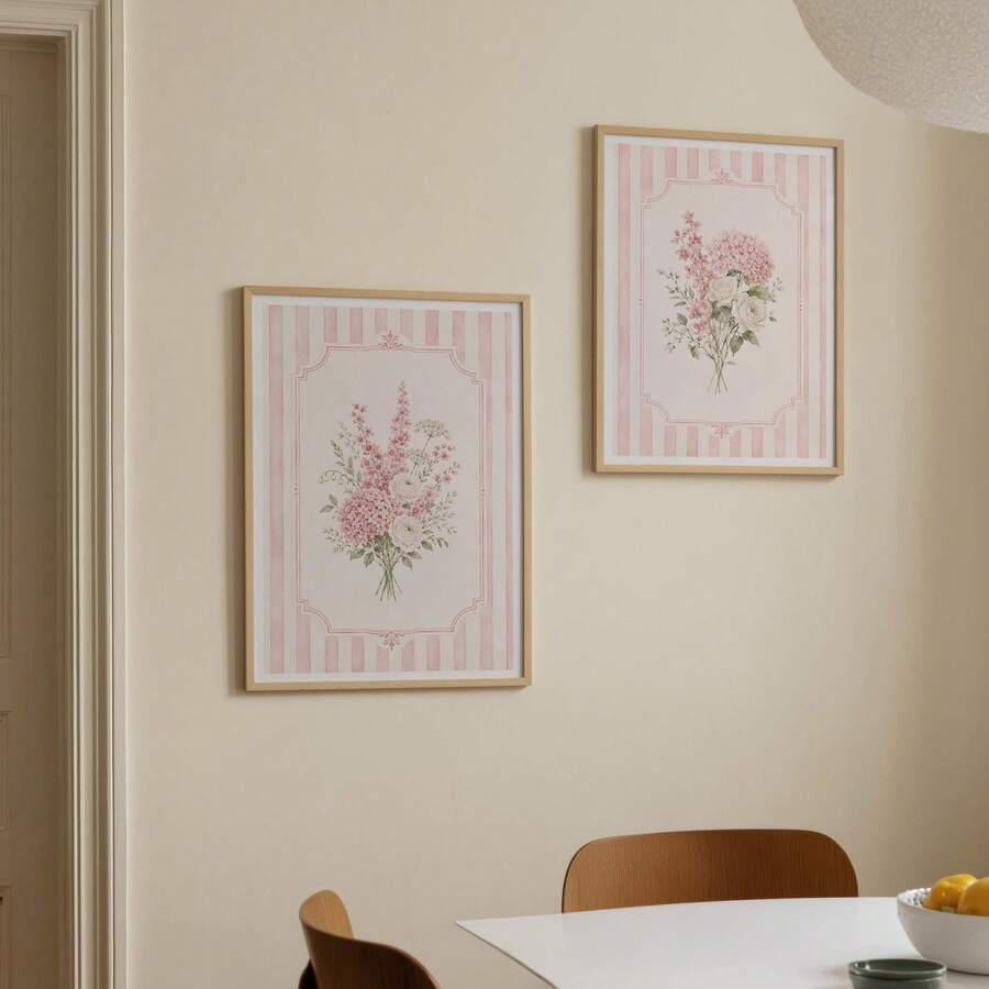 Pair of pink striped wildflower canvas prints with cream and blush floral bouquets in pale wood frames