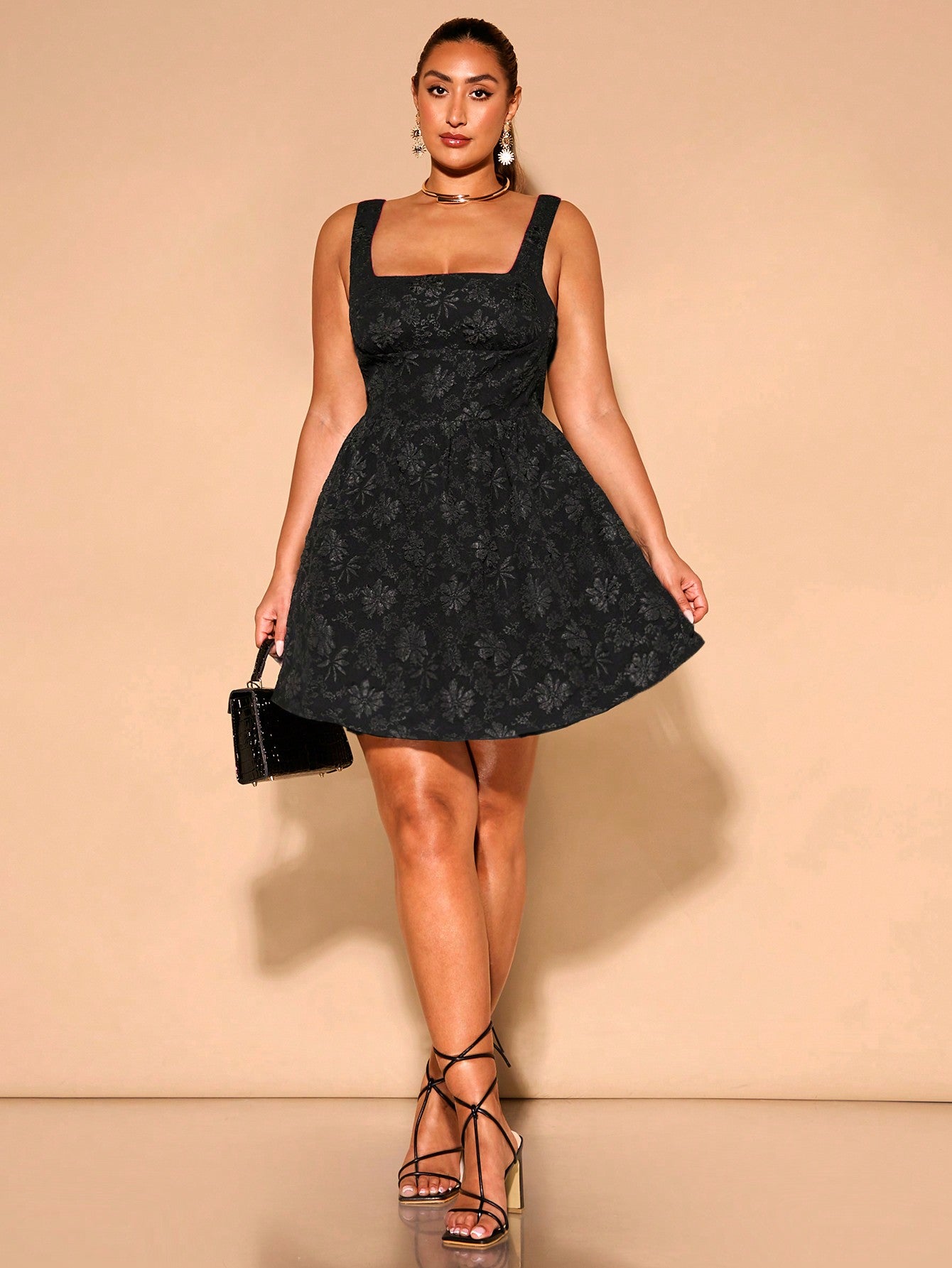 Step into summer with this charming plus size black textured A-line dress, designed to flatter every curve. Its wide straps offer comfort and support, perfect for sunny holiday adventures. The textured fabric adds a playful touch, while the A-line silhouette ensures effortless style and movement. Ideal for beach days or casual strolls, this dress combines comfort and chic for your warm-weather wardrobe.