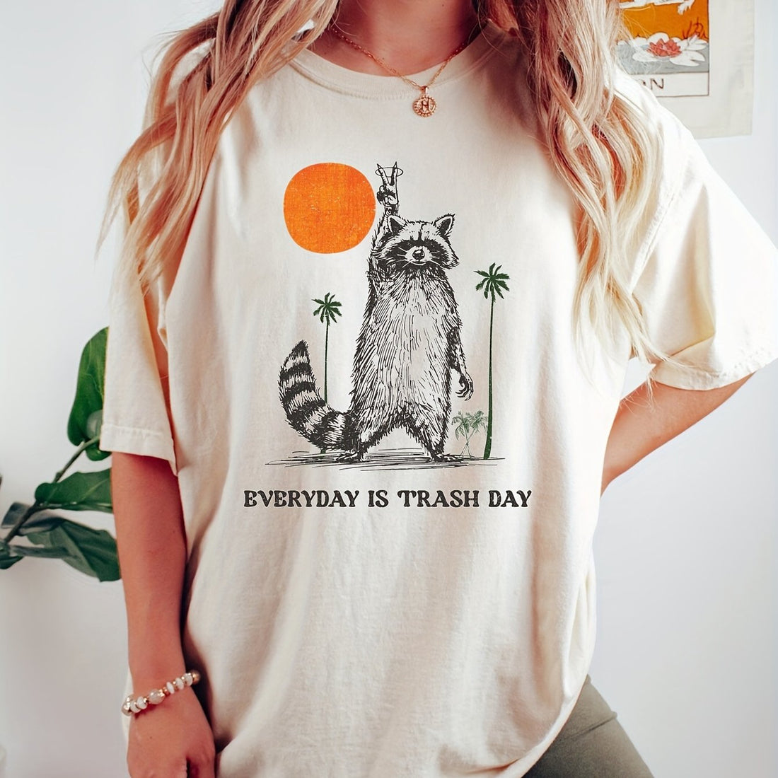 This charming raccoon graphic tee is designed for women who want to add a playful touch to their casual outfits. Made with high-quality materials, this short sleeve top features a charming raccoon graphic that is sure to turn heads. Perfect for adding a fun yet stylish element to your wardrobe.