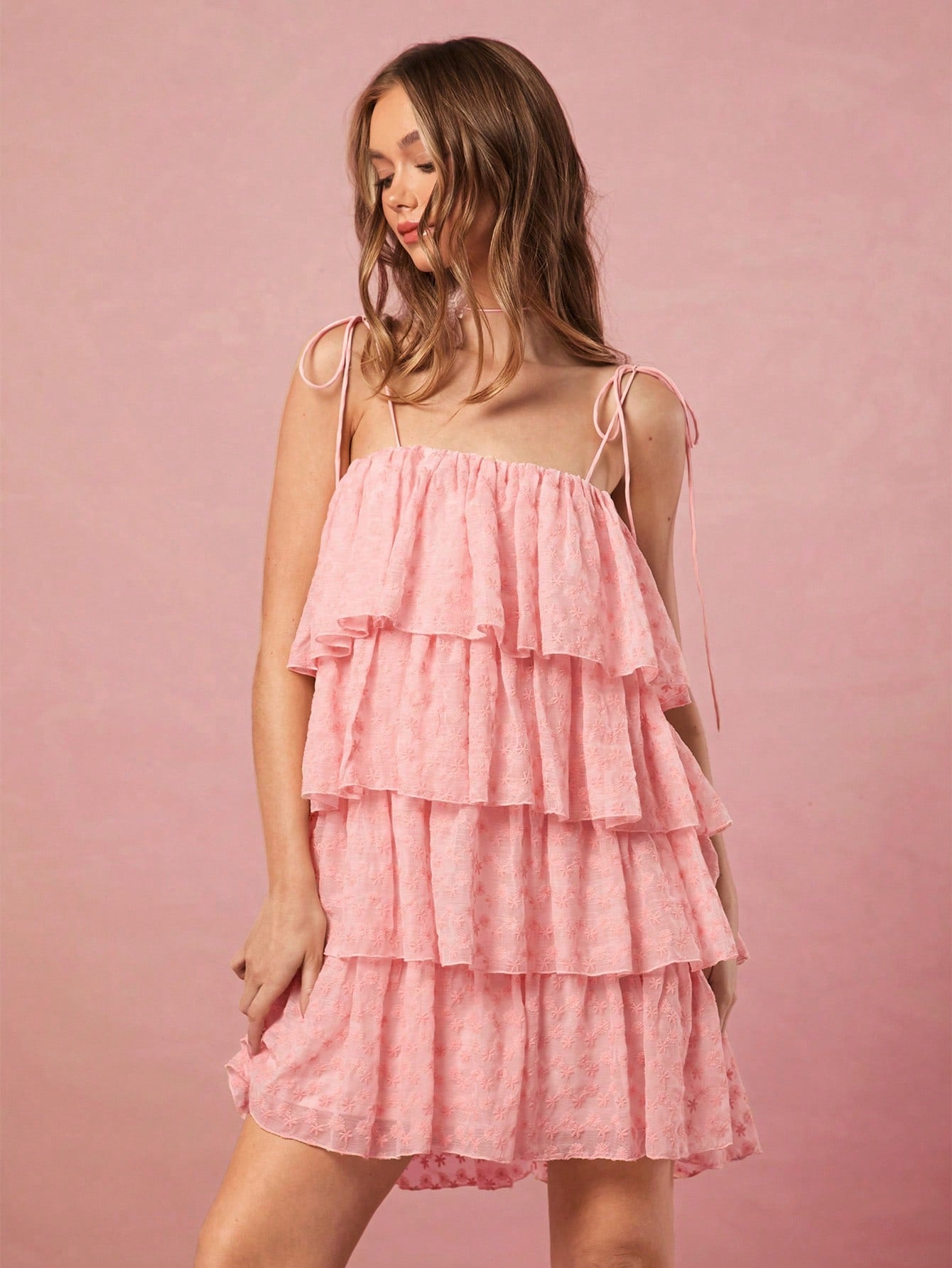 Get ready to charm everyone with our Charming Ruffled Mini Dress! This dress is perfect for any summer occasion with its elegant ruffled design and strappy details. You'll be the talk of the party, exuding both playfulness and style. So go ahead, turn heads and make a statement with this dress!