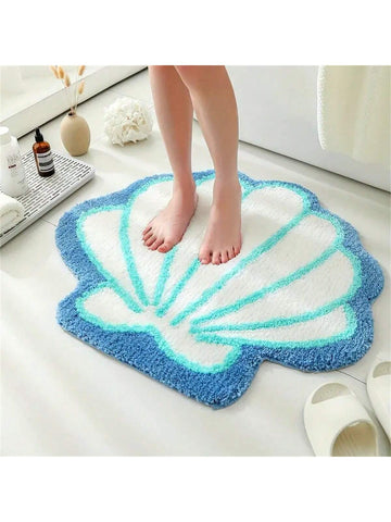 Bring a splash of seaside fun to your bathroom with this charming shell-shaped mat. Crafted from soft faux velvet, it offers a cozy, plush feel underfoot while adding a whimsical ocean-inspired touch to your decor. Perfect for brightening up your space with a playful vibe, this mat combines comfort and style effortlessly.