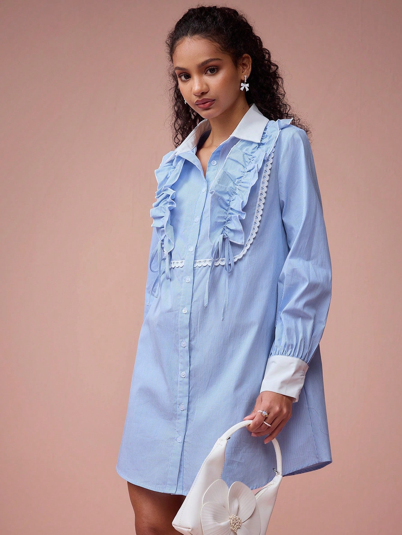 Elevate your spring and summer style with our Charming Striped Lotus Leaf Collar Dress. This playful and flirty dress features a delicate lotus leaf collar and a classic striped pattern, making it the perfect choice for romantic outings. Step out in style and turn heads with this must-have dress.