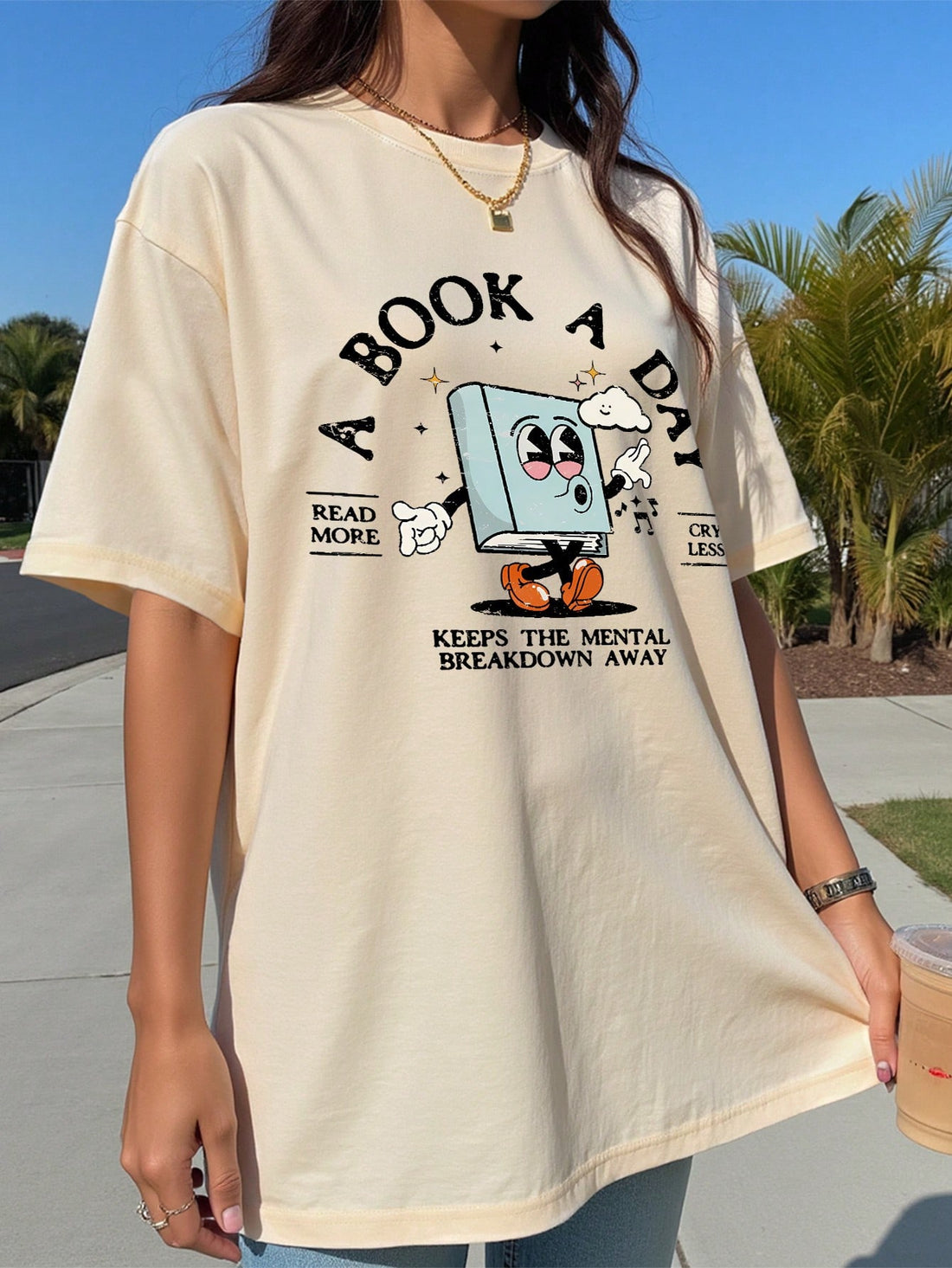 Embrace sunny days in style with this playful women’s summer tee featuring a fun cartoon graphic and a catchy slogan. Its oversized fit offers a relaxed, breezy feel perfect for warm weather adventures. Whether paired with shorts or jeans, this tee adds a cheerful vibe to your casual wardrobe.