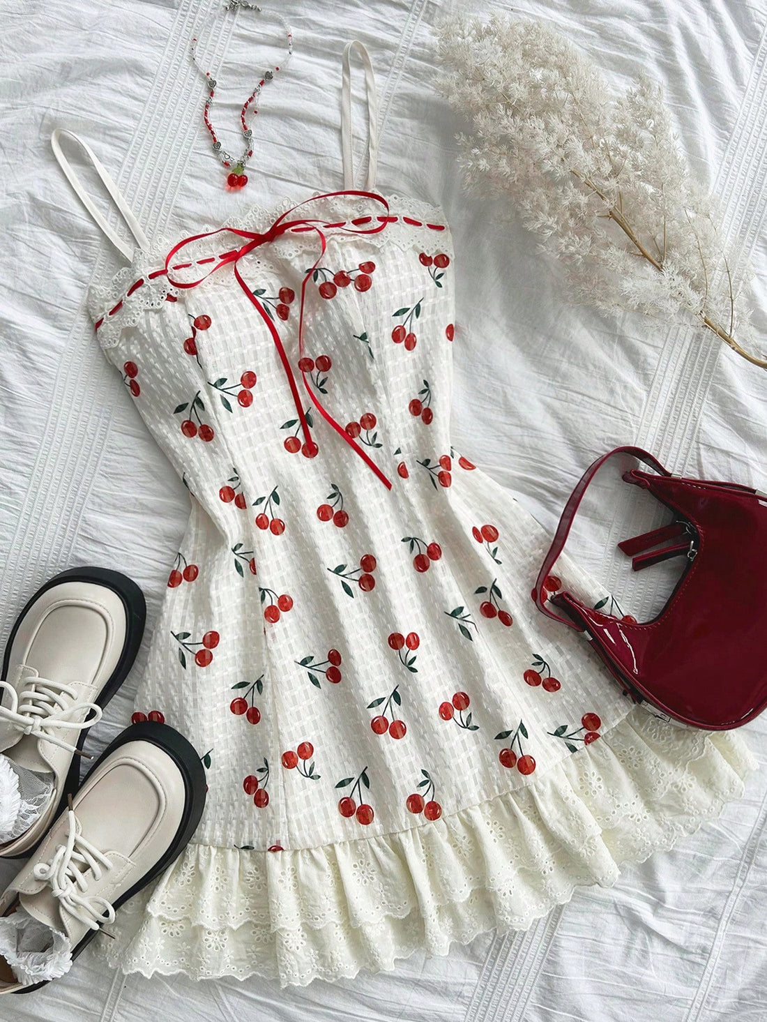 Discover the beauty of spring with our Cherry Blossom Delight dress. Made with delicate lace and ruffled accents, this vacation dress is perfect for a day out exploring. Embrace your femininity and feel effortlessly elegant in our Dreamara creation.