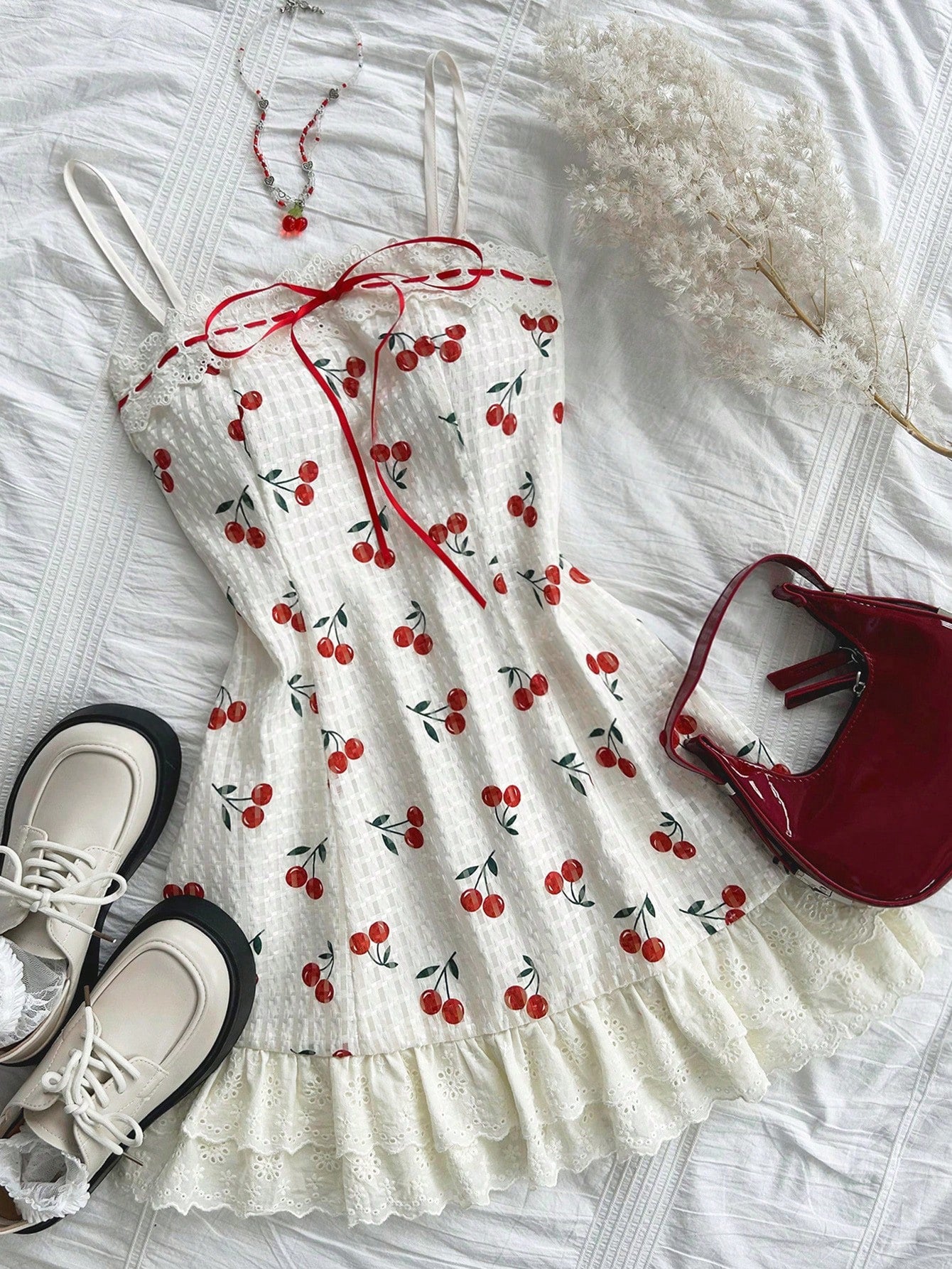 Discover the beauty of spring with our Cherry Blossom Delight dress. Made with delicate lace and ruffled accents, this vacation dress is perfect for a day out exploring. Embrace your femininity and feel effortlessly elegant in our Dreamara creation.