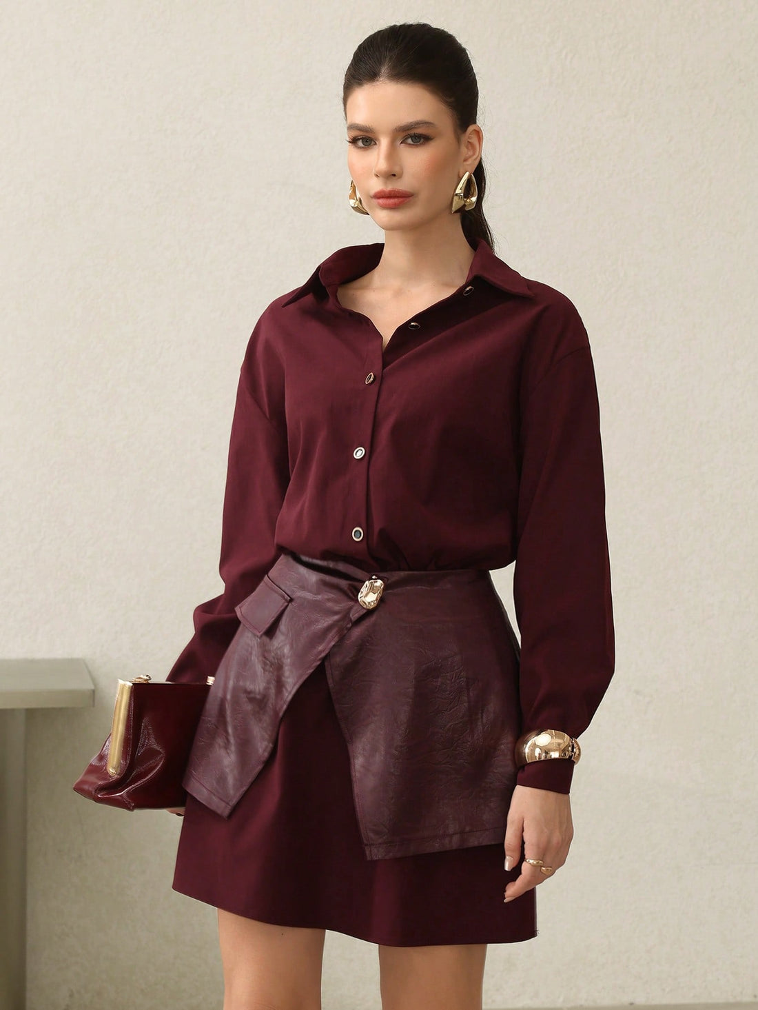 Elevate your seasonal wardrobe with this stunning 2-piece shirt dress in rich Encore red. The clever waist tie detail cinches your silhouette while the coordinating pieces layer effortlessly for versatile styling. Whether you're dressing up for brunch or keeping it casual, this chic ensemble transitions seamlessly from autumn into winter. The sophisticated color and thoughtful construction make it a go-to piece that works as hard as you do. Dress it up with heels or down with sneakers—this is the kind of wa