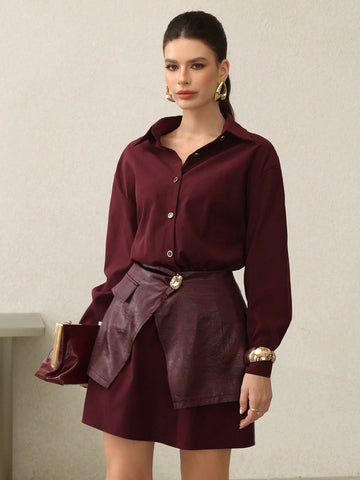 Elevate your seasonal wardrobe with this stunning 2-piece shirt dress in rich Encore red. The clever waist tie detail cinches your silhouette while the coordinating pieces layer effortlessly for versatile styling. Whether you're dressing up for brunch or keeping it casual, this chic ensemble transitions seamlessly from autumn into winter. The sophisticated color and thoughtful construction make it a go-to piece that works as hard as you do. Dress it up with heels or down with sneakers—this is the kind of wa