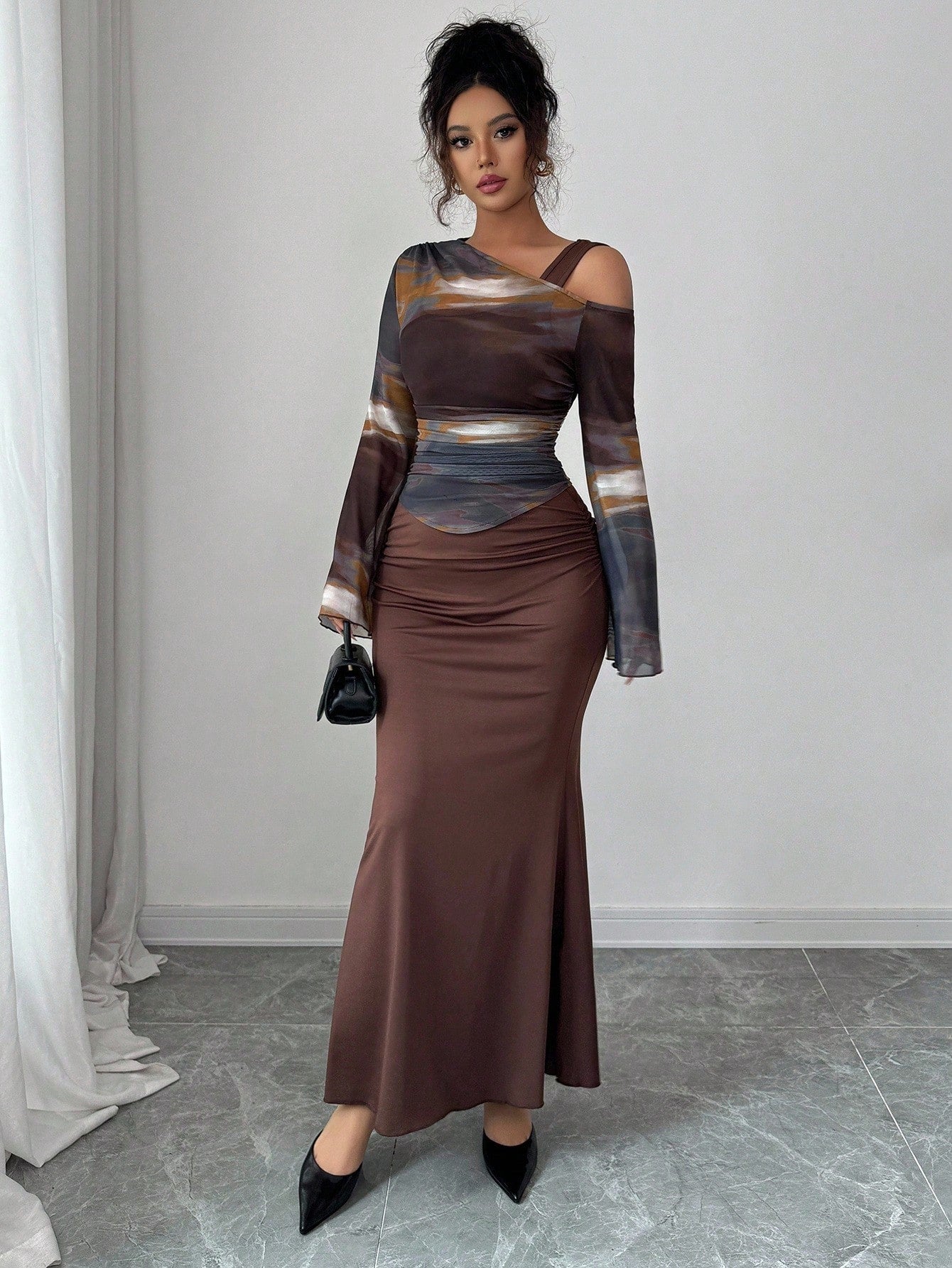 Turn heads this season with our stunning 2-piece knitted mesh bodycon skirt set. The fitted silhouette hugs your curves in all the right ways, while the sheer mesh detailing adds an edgy, modern twist. Layer the coordinating pieces for a bold statement look, or mix and match with your favorite basics. Crafted from quality knit fabric that moves with you, this set delivers comfort without compromising on style. Your go-to pick for nights out, date nights, or whenever you want to feel absolutely fabulous.