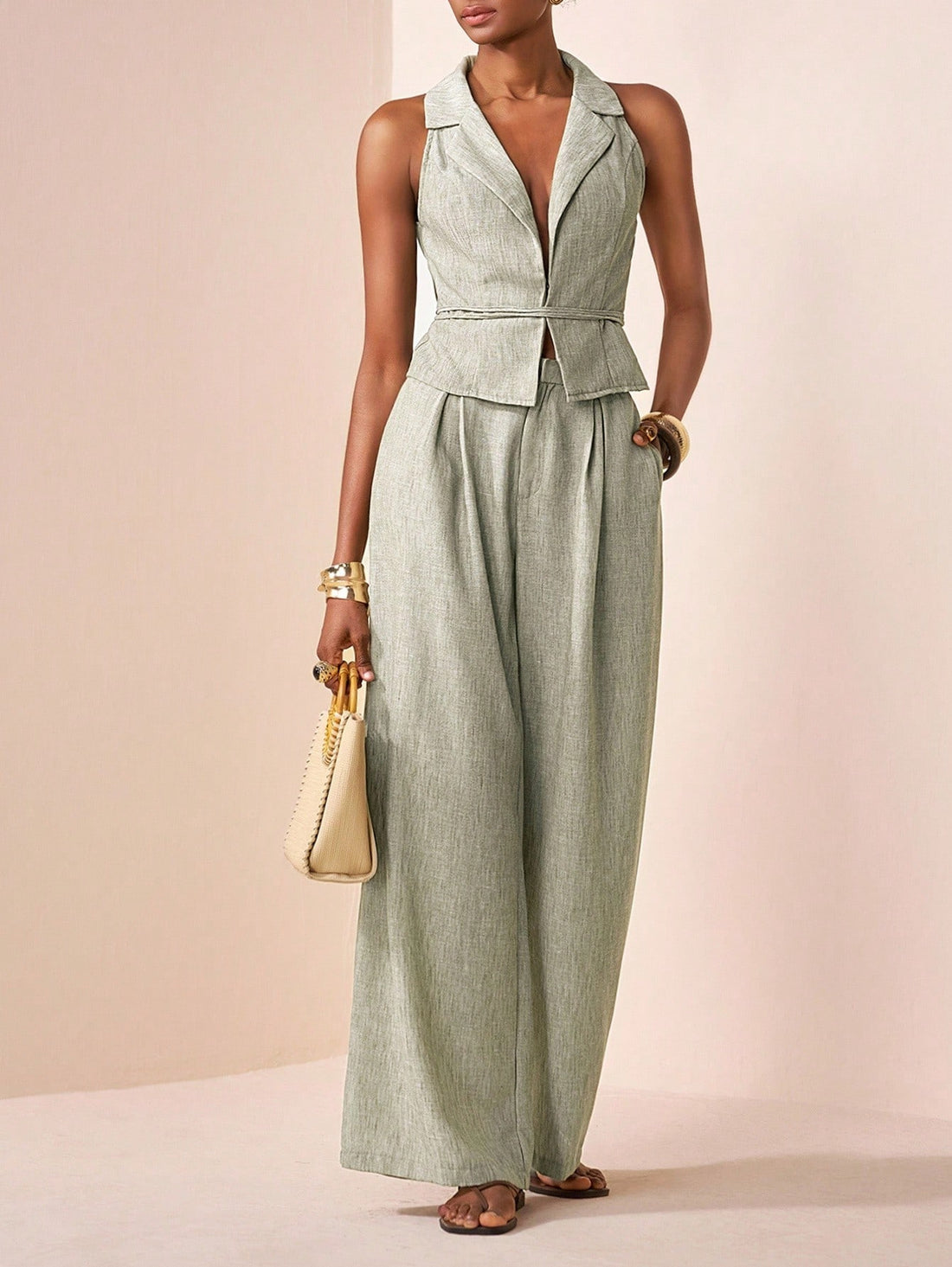 Elevate your wardrobe with this fabulous two-piece set that's ready for anything! The sleek sleeveless vest pairs perfectly with tailored straight-leg pants in a gorgeous green shade that flatters every skin tone. Whether you're dancing at summer festivals, celebrating at weddings, or keeping it chic for everyday adventures, this versatile combo delivers effortless style. Mix and match with your favorite pieces or wear them together for an instantly polished look. It's the outfit that works as hard as you d