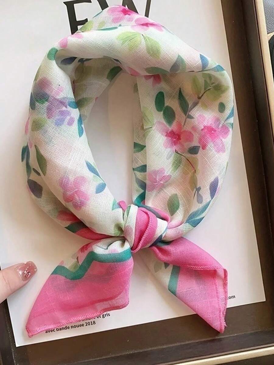 Elevate your seasonal wardrobe with this elegant 60cm silk scarf, featuring a delicate pink ditsy floral pattern that captures the essence of spring and autumn. Crafted from luxurious silk, this versatile accessory drapes beautifully around your neck, shoulders, or hair, adding a touch of sophistication to any outfit. The timeless floral design complements both casual and dressed-up looks, making it an essential piece for transitional weather. Perfect for layering.