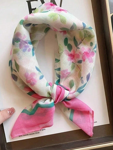 Elevate your seasonal wardrobe with this elegant 60cm silk scarf, featuring a delicate pink ditsy floral pattern that captures the essence of spring and autumn. Crafted from luxurious silk, this versatile accessory drapes beautifully around your neck, shoulders, or hair, adding a touch of sophistication to any outfit. The timeless floral design complements both casual and dressed-up looks, making it an essential piece for transitional weather. Perfect for layering.