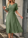 This chic A-line dress features a flattering notched neckline and elegant button details. Crafted with precision, this dress offers a sophisticated look with effortless style. The A-line silhouette drapes beautifully, enhancing your figure and providing a comfortable fit. Perfect for any occasion, this dress is a versatile addition to your wardrobe.