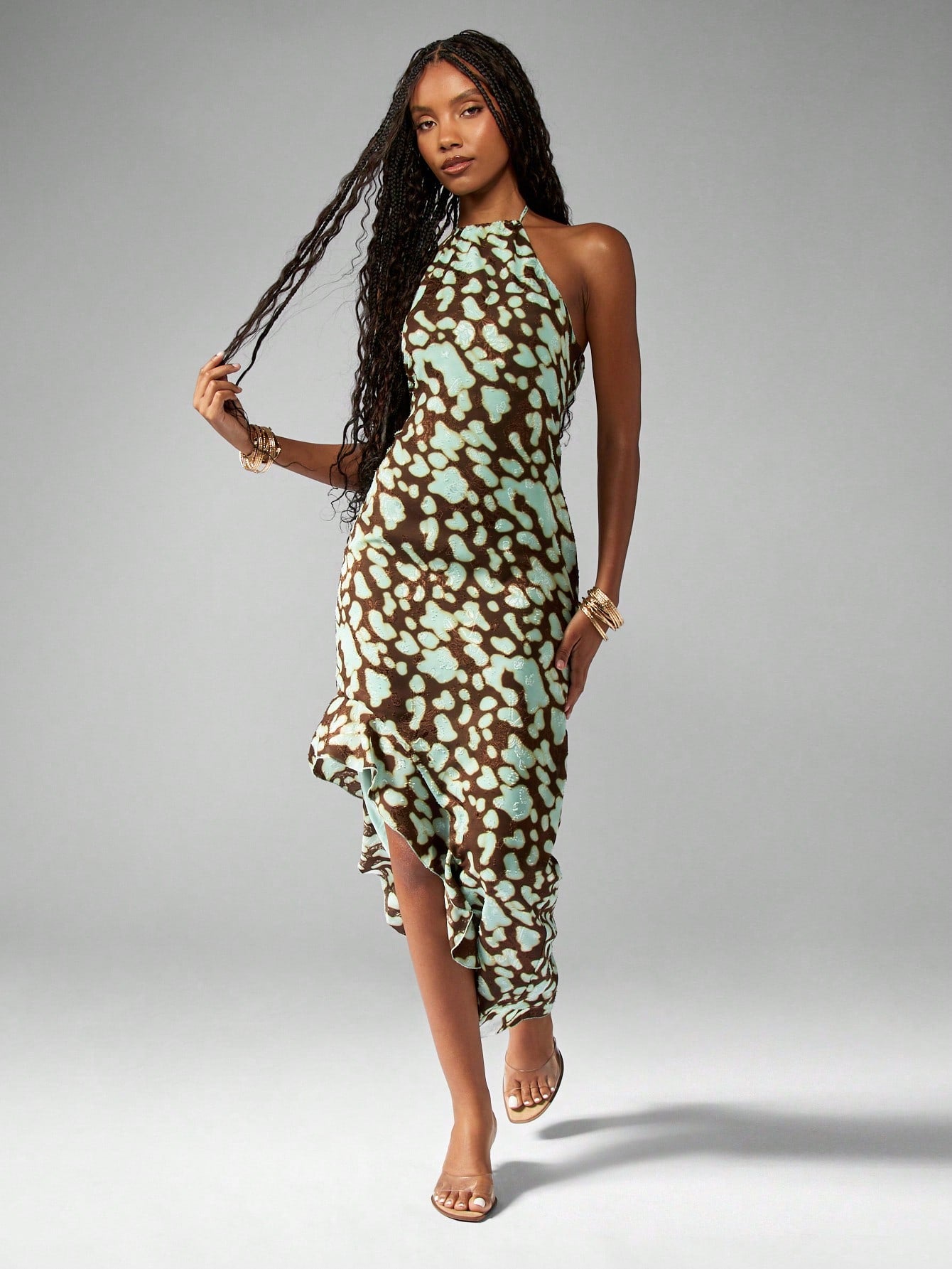 Turn heads this summer with our Chic Abstract Print Halter Neck Maxi Dress, perfect for vacations and beach weddings. Its vibrant abstract design and breezy halter neck create a playful vibe that dances with the ocean breeze. Lightweight and flowy, this dress keeps you cool while making every step feel like a celebration. Embrace effortless style that’s ready for sun-soaked memories and seaside romance.