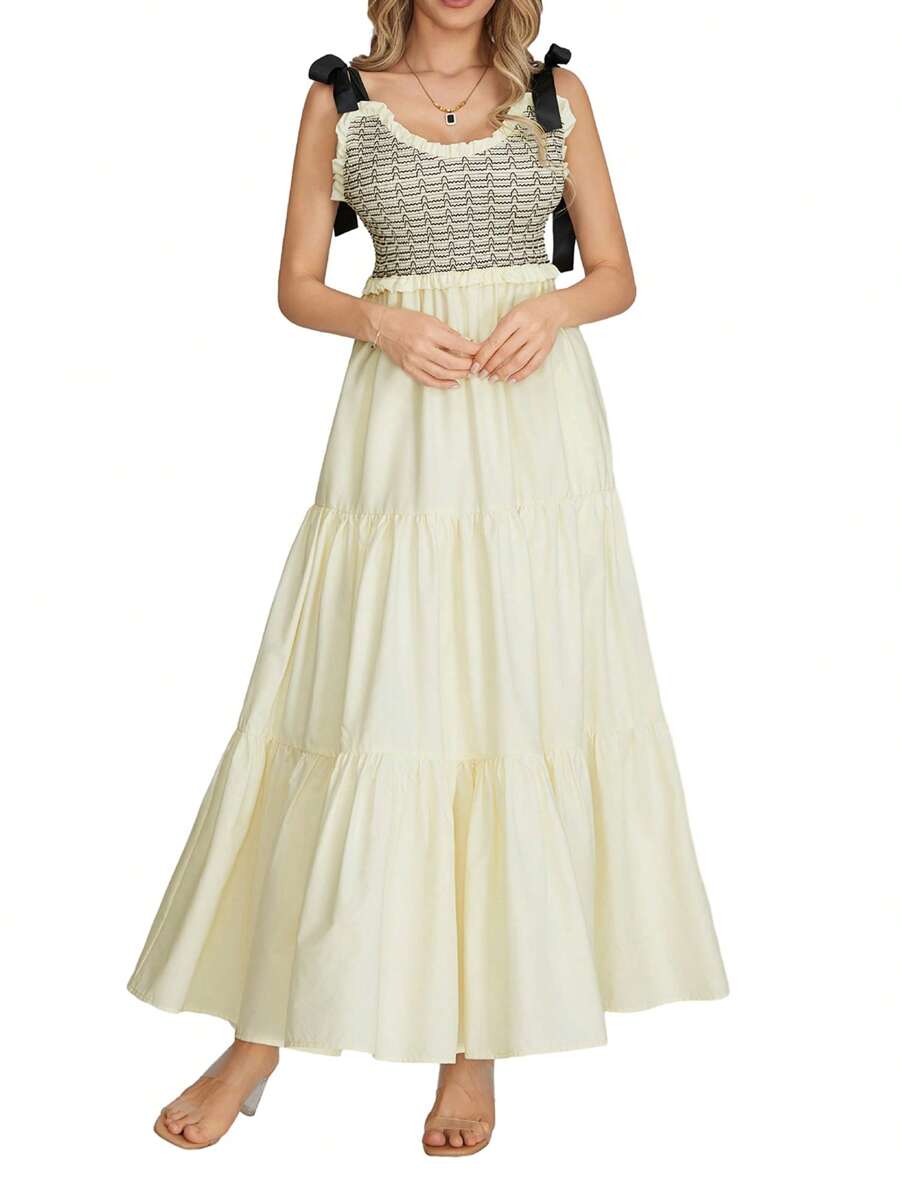 Effortlessly stylish for summer, this abstract print dress features a V-neck and sleeveless design. Perfect for any occasion, it's a must-have for your wardrobe. Stand out in chic style!