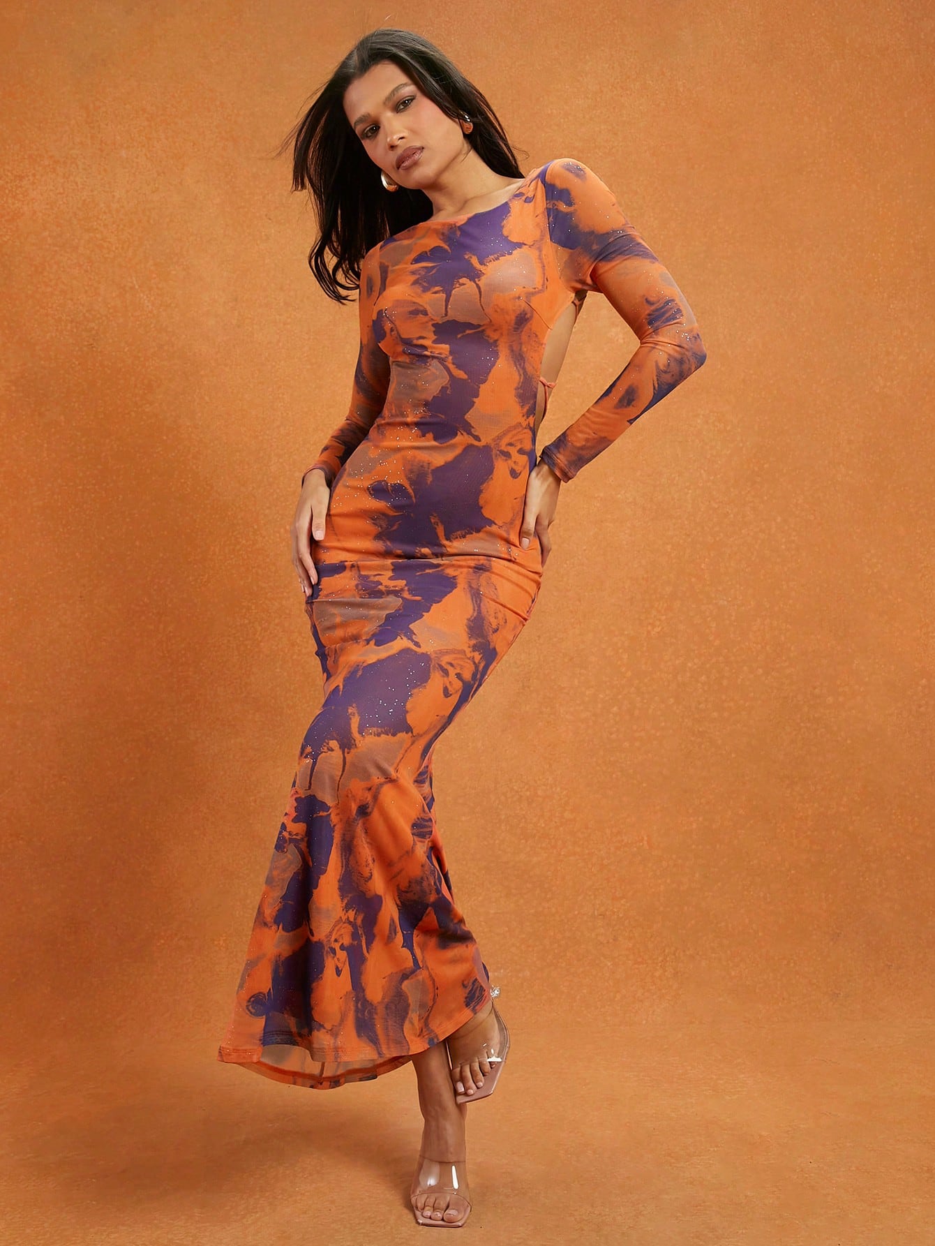 Step into vacation mode with this Chic Abstract Printed Maxi Dress! The flowing silhouette pairs perfectly with playful mesh details and a daring lace-up back, creating a breezy yet elegant look for sunny days and evening strolls. Embrace effortless style that’s bound to turn heads wherever your getaway takes you.