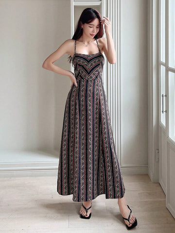 Effortlessly chic for any occasion! This all-over print cami dress features a fun and flirty lace-up backless design, perfect for showing off your playful and stylish side. Stay comfortable and stylish in this unique and versatile dress.