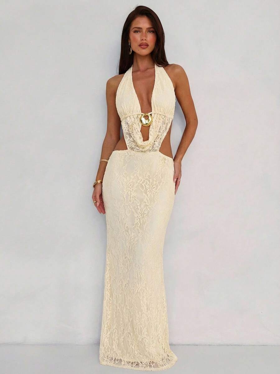 Elevate your date night with this chic backless dress featuring striking metal embellishments. The daring open-back design showcases confidence and sophistication, while metallic details catch the light for added glamour. 