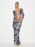 Make a statement at your next winter soirée in this stunning animal print maxi dress. The daring cut-out waist adds modern edge while the flowing silhouette flatters every figure. Crafted for those who love bold patterns and aren't afraid to turn heads, this dress transitions effortlessly from holiday parties to formal galas. The maxi length keeps things sophisticated, while the playful print brings personality to any occasion. Slip it on and let your confidence do the talking.