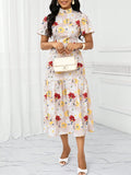 Elevate your holiday wardrobe with this chic apricot beige floral print long dress. The perfect blend of style and comfort, this dress features a slim fit skirt that flatters your figure. Show off your playful side with this must-have addition to your closet.