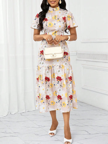 Elevate your holiday wardrobe with this chic apricot beige floral print long dress. The perfect blend of style and comfort, this dress features a slim fit skirt that flatters your figure. Show off your playful side with this must-have addition to your closet.
