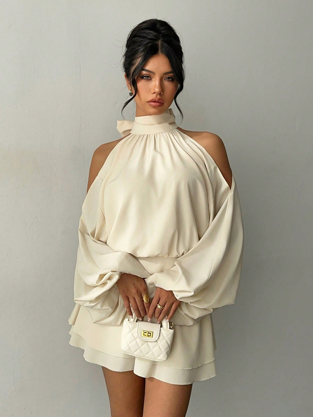 Slip into effortless elegance with this apricot mini dress that's ready to turn heads at your next gathering. The dramatic long lantern sleeves add a touch of whimsy and sophistication, while the flattering silhouette keeps things chic and modern. Whether you're heading to a cozy autumn party or a winter date night, this versatile piece transitions seamlessly from season to season. The warm apricot hue complements all skin tones and pairs beautifully with your favorite boots or heels. A playful yet polished