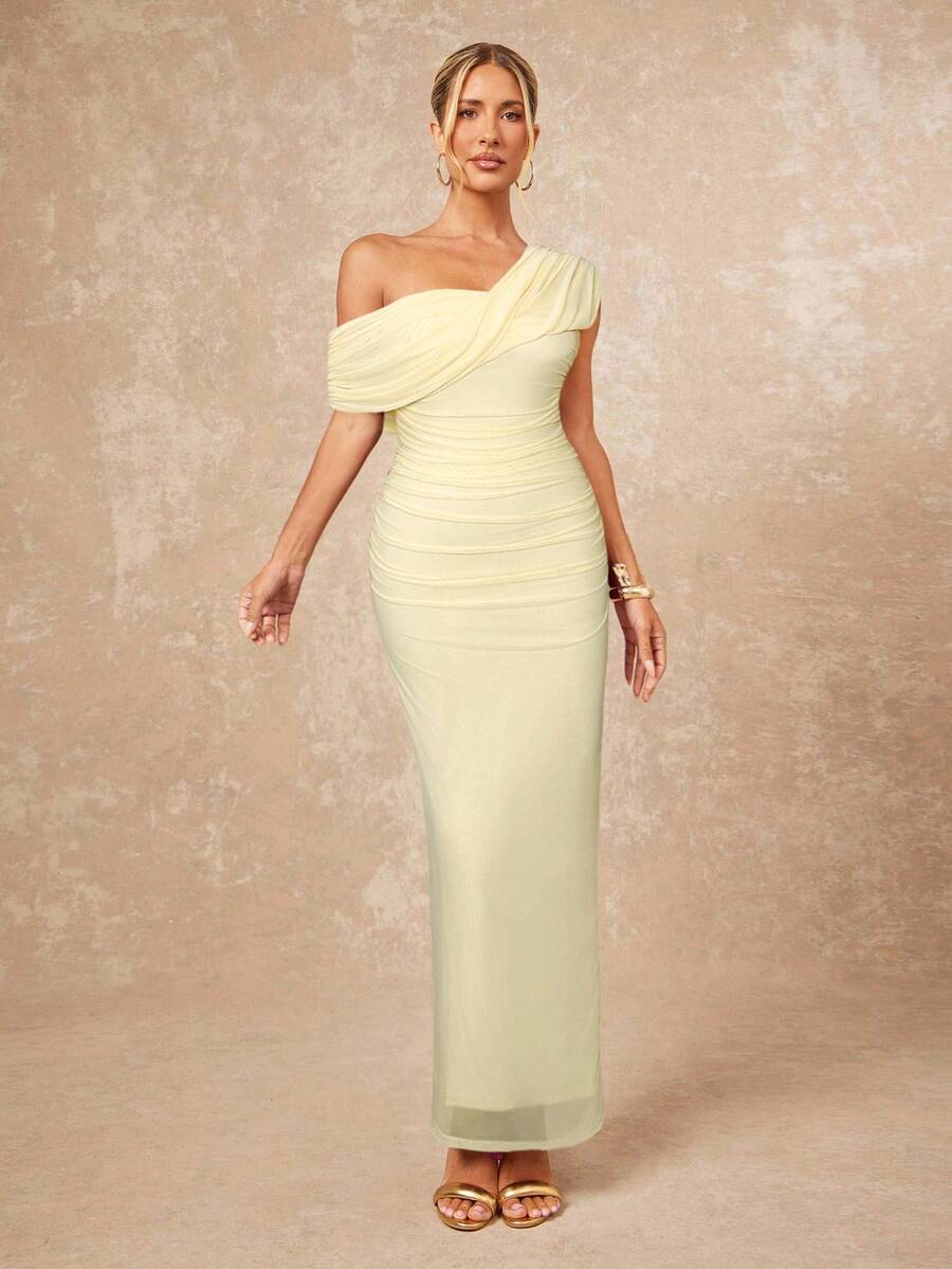 Elevate your formal wardrobe with this stunning apricot bodycon dress, designed for those who appreciate timeless elegance. Featuring an asymmetrical one-shoulder neckline and flattering ruched detailing, this maxi dress creates a sophisticated silhouette perfect for beach weddings, evening galas, and special occasions. The sleeveless design and pencil hem offer a refined, streamlined look, while the medium-stretch mesh fabric blend of 94% polyamide and 6% elastane ensures comfortable all-day wear. Fully li