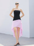 Step into the spotlight with this playful black and pink midi dress featuring a chic asymmetric design. Perfect for spring and summer, its unique cut adds a fun twist to your elegant wardrobe, making every occasion feel special and stylish.