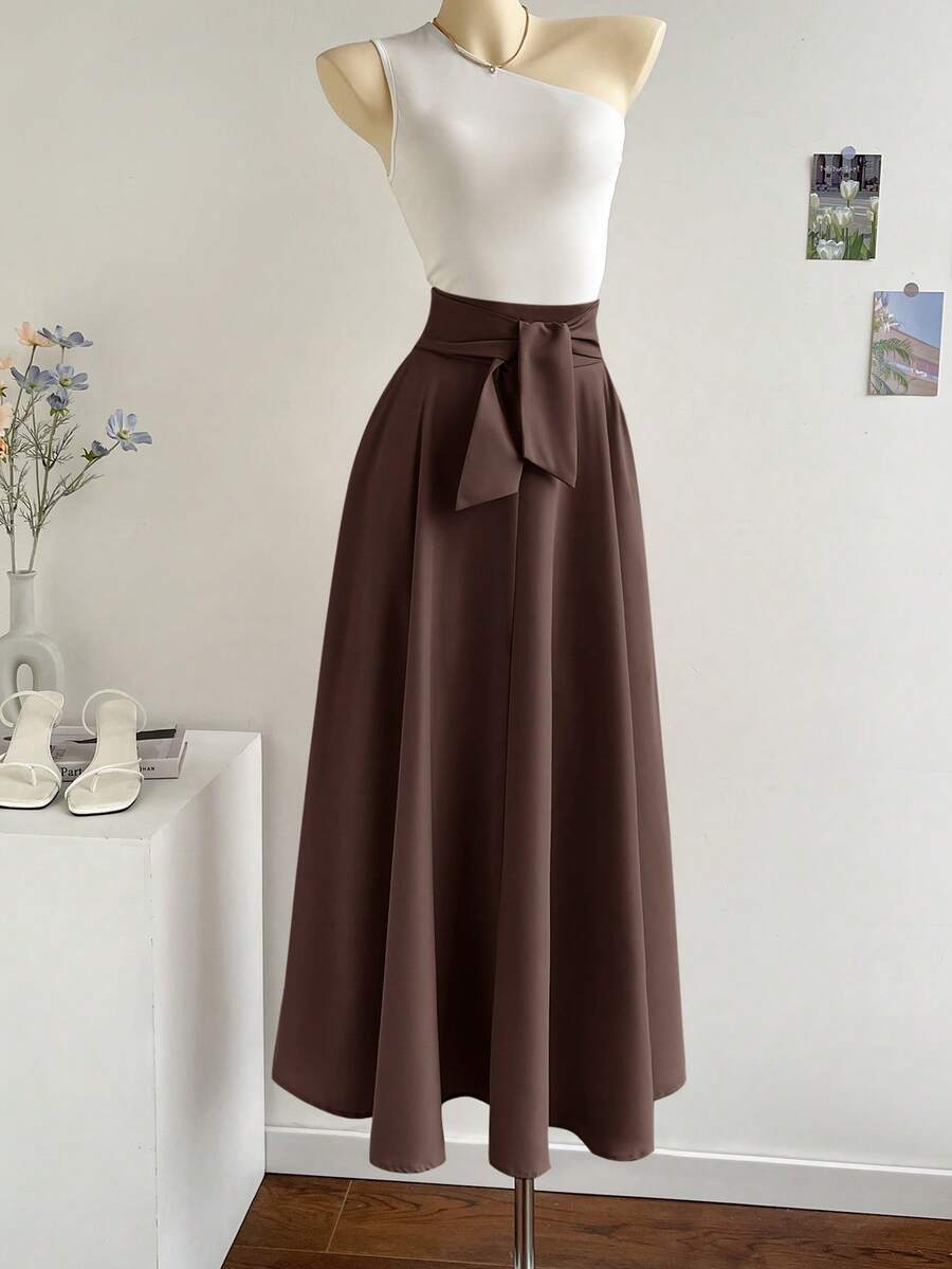 Elevate your wardrobe with this fabulous two-piece set that's equal parts sophisticated and fun! The asymmetric neckline top adds an unexpected twist that catches every eye, while the oversized A-line skirt flows beautifully for all-day comfort and movement. Perfect for brunch dates, casual outings, or whenever you want to feel effortlessly chic. Mix, match, or wear together—this dynamic duo works hard so you don't have to!