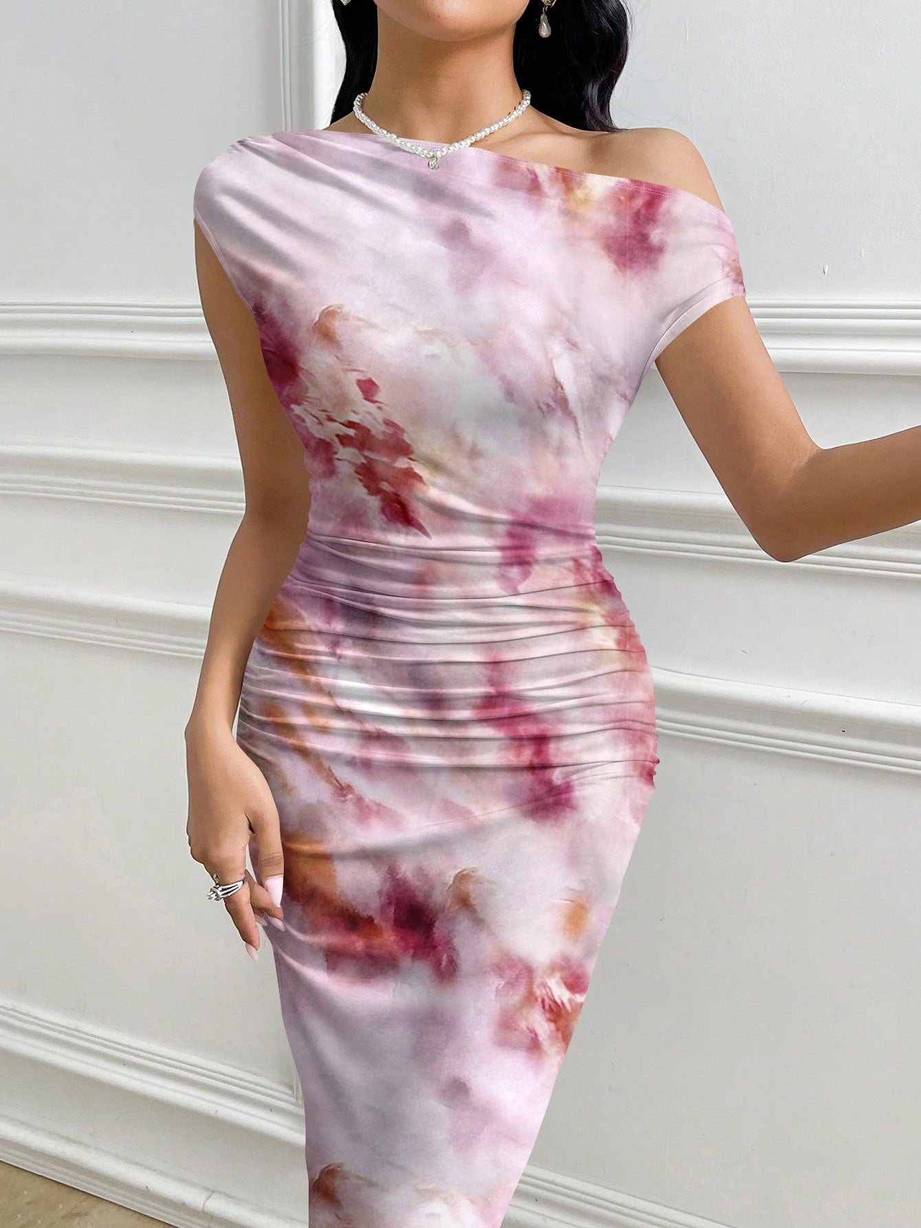 Unleash stylish vacation vibes with this Chic Asymmetric Oblique Shoulder Bodycon Dress. Its unique abstract print adds a playful touch while the oblique shoulder design keeps things interesting. Whether sightseeing or hitting the beach, this dress has got you covered (literally)!