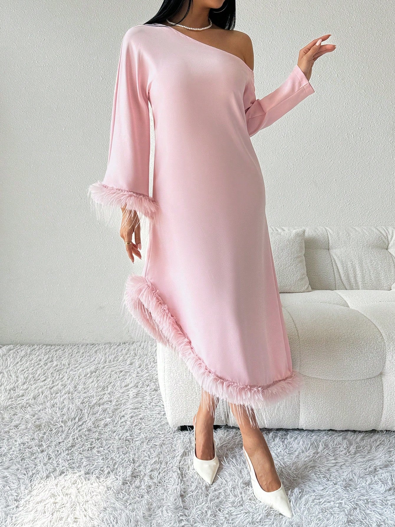 Elevate your wardrobe with our Chic Asymmetrical Knit Dress. This stylish piece features fuzzy cuffs for a touch of sophistication and effortless elegance. The asymmetrical design adds a unique twist to a classic dress, making it perfect for any occasion. Stay stylish and comfortable with our chic dress.