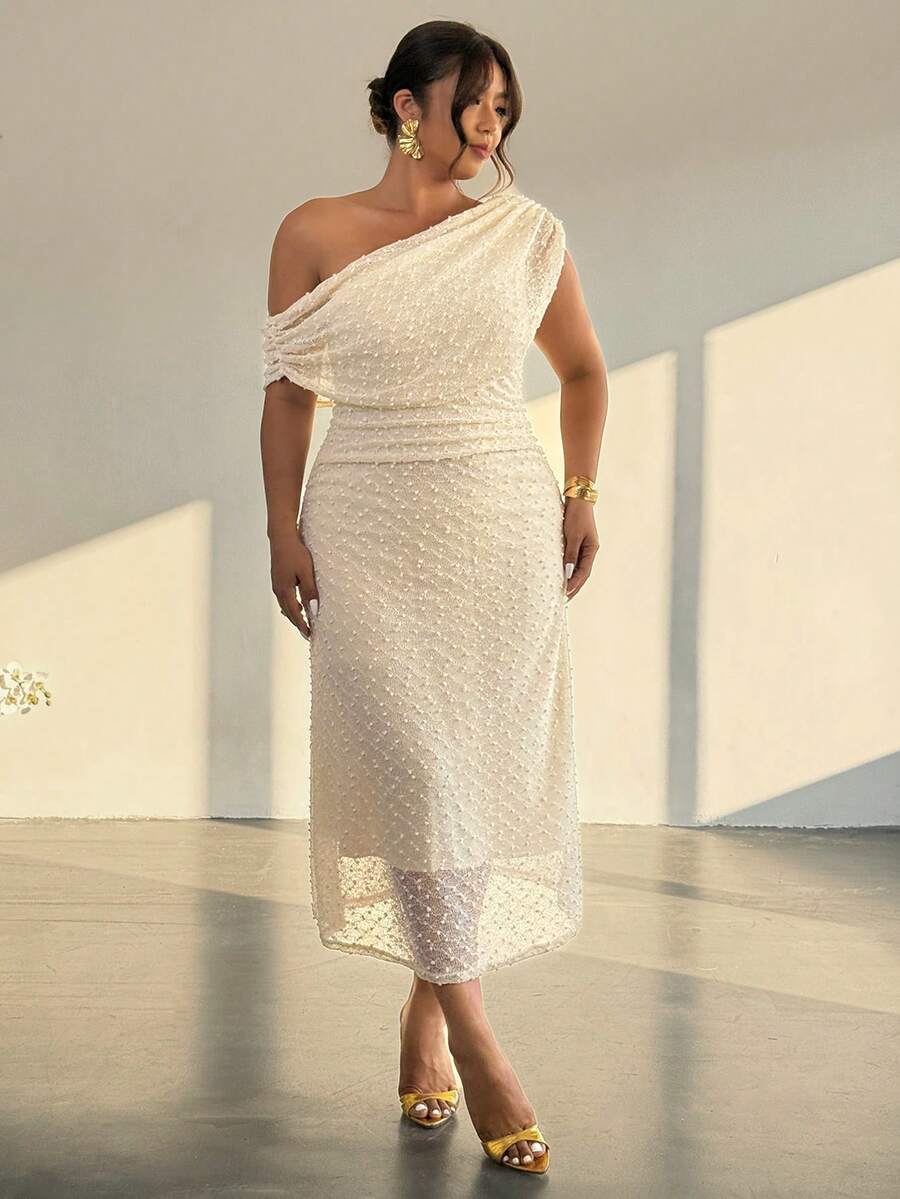 Elevate your seasonal wardrobe with this sophisticated asymmetrical dress, designed for confident style. The elegant one-shoulder silhouette creates a flattering, modern look while the soft knit fabric ensures all-day comfort. Rich burgundy tones complement any complexion and pair effortlessly with your favorite accessories. Perfect for brunches, dinners, or casual outings, this versatile piece transitions seamlessly from spring into summer. 