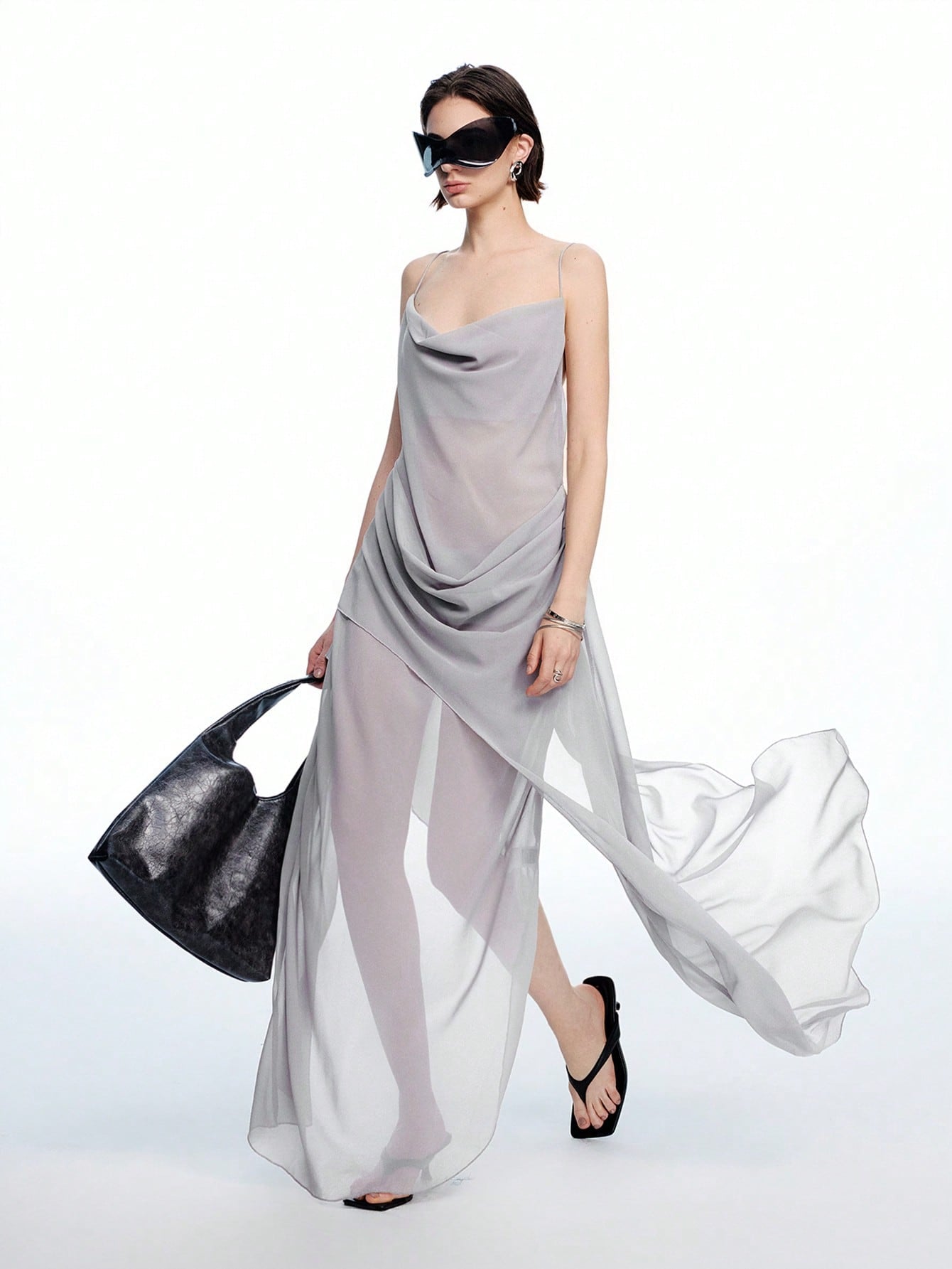 Turn heads this summer with our Chic Asymmetrical Ruffle Neck Long Dress. Featuring a flirty open back and playful ruffles, it’s the perfect choice for warm-weather parties. Lightweight and breezy, this dress combines elegance with a fun twist, making every step feel like a celebration.