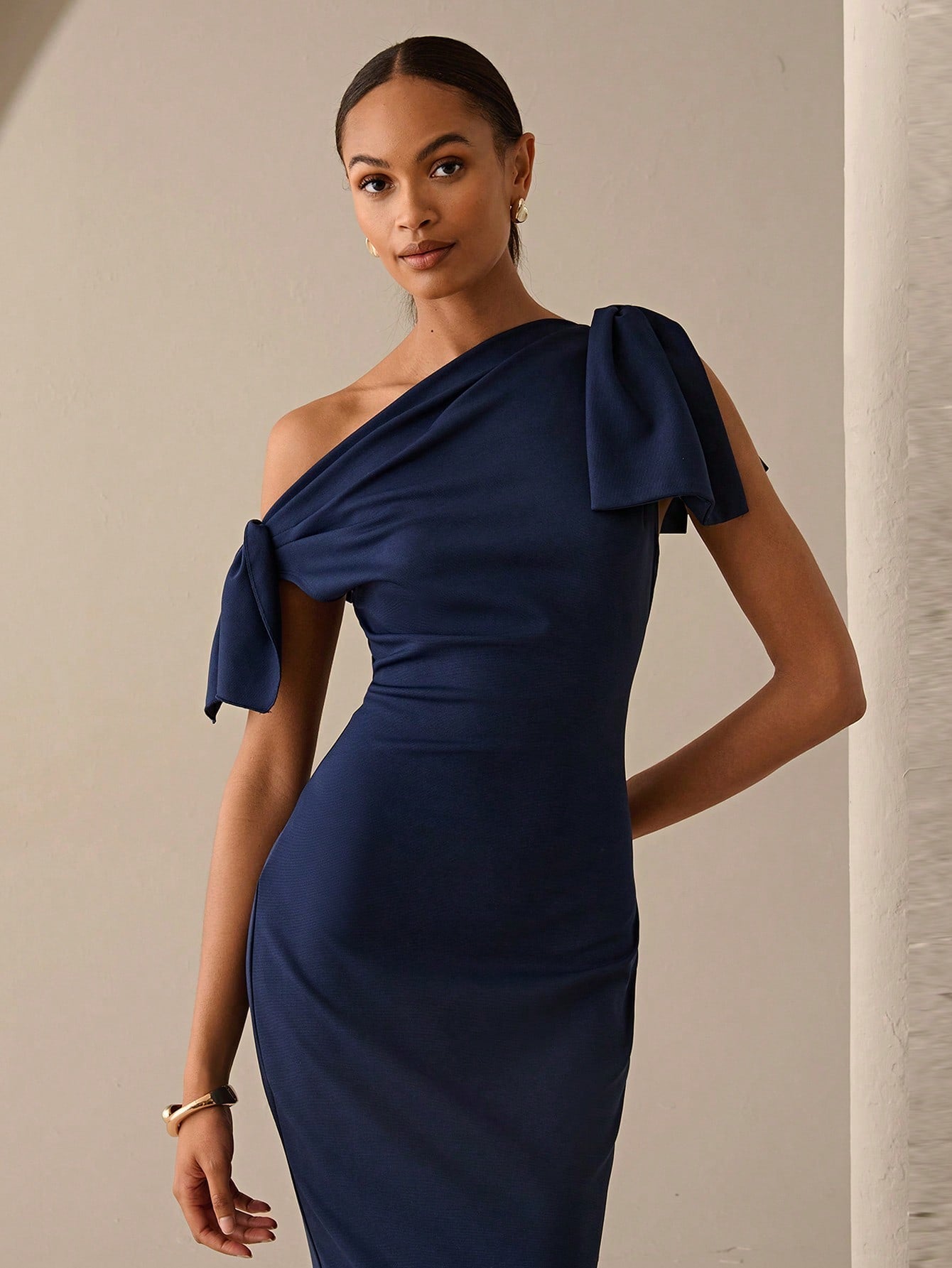 Turn heads effortlessly with this Chic Asymmetrical Shoulder Bowknot Dress, perfect for both office hours and date nights. Its unique asymmetrical design adds a playful twist to your wardrobe, while the elegant bowknot detail brings a touch of charm. Comfortable and stylish, this dress lets you transition seamlessly from work to evening fun with confidence and flair.