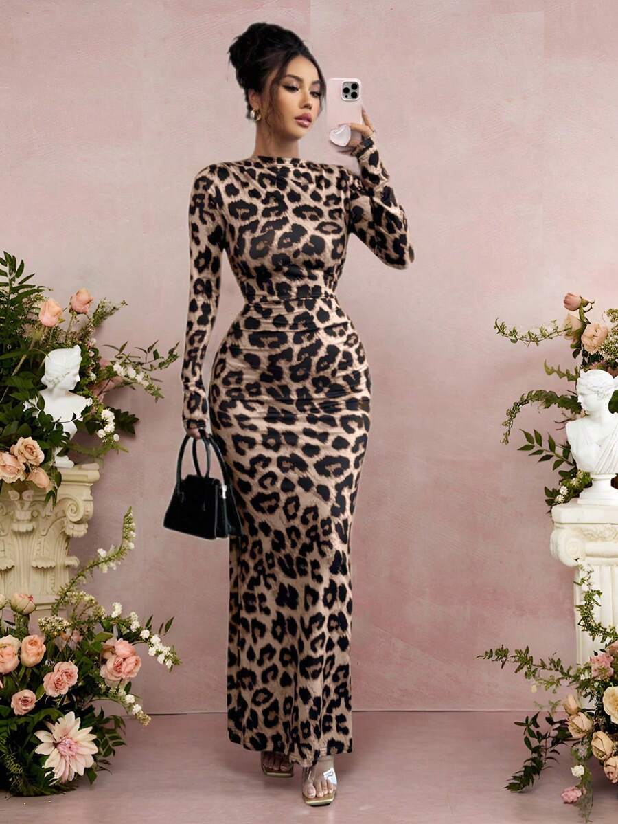 Unleash your wild side this season with our stunning leopard print bodycon dress—the ultimate piece for turning heads. Featuring a flattering ruched long sleeve design, this dress hugs your curves in all the right ways while keeping you cozy through autumn and winter. The classic leopard pattern adds instant edge and sophistication to any outfit, whether you're heading to brunch, a night out, or making a statement at the office. Versatile, chic, and undeniably fabulous, this dress is your new go-to for effo