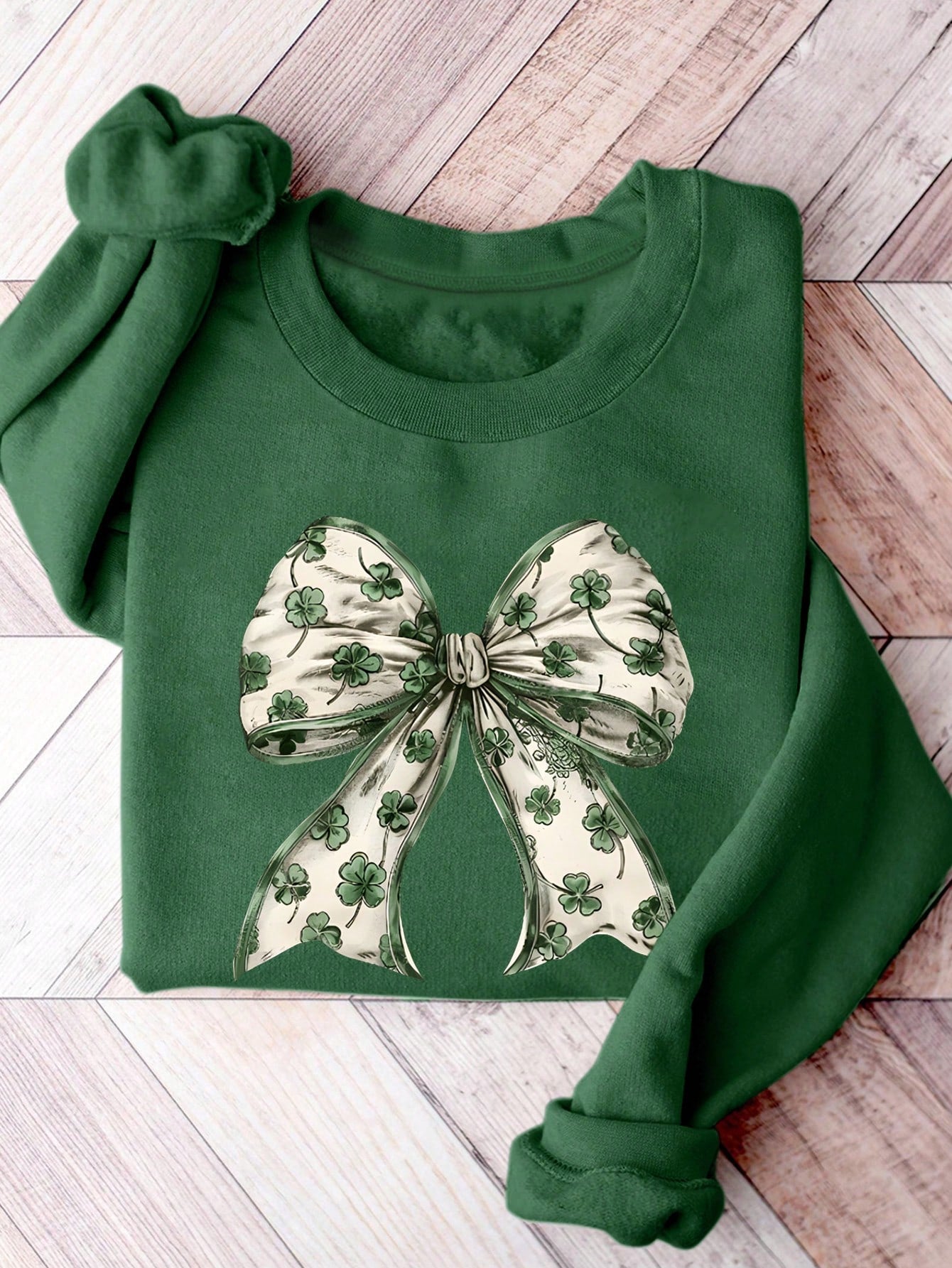 Effortlessly elevate your casual style with our Chic Autumn-Winter Sweatshirt. Featuring a playful clover bow print, this sweatshirt adds a touch of quirkiness to your wardrobe. Stay comfortable and chic all season long. (2 exclamation points)