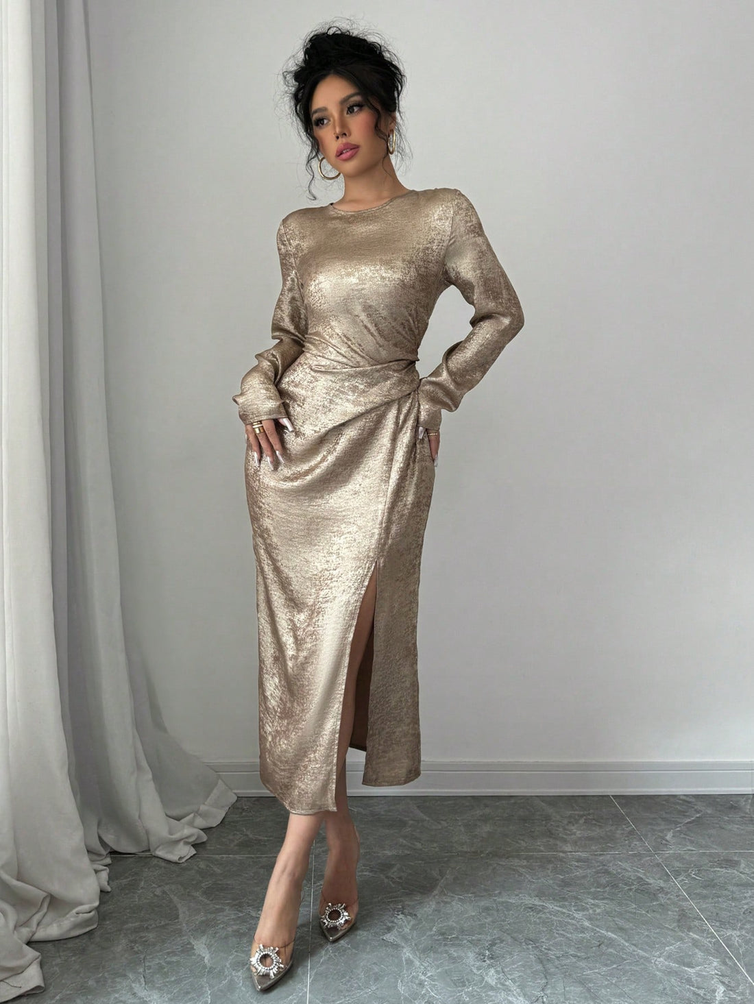 Embrace the season in this stunning asymmetrical bodycon maxi dress that's equal parts sophisticated and show-stopping. The shimmering gold foil detailing catches the light beautifully, adding just the right amount of glamour to your autumn wardrobe. With its flattering fitted silhouette and dramatic asymmetrical hemline, this dress transitions effortlessly from evening events to upscale dinners. Perfect for anyone who loves making a bold fashion statement while staying timelessly elegant. Slip it on and le